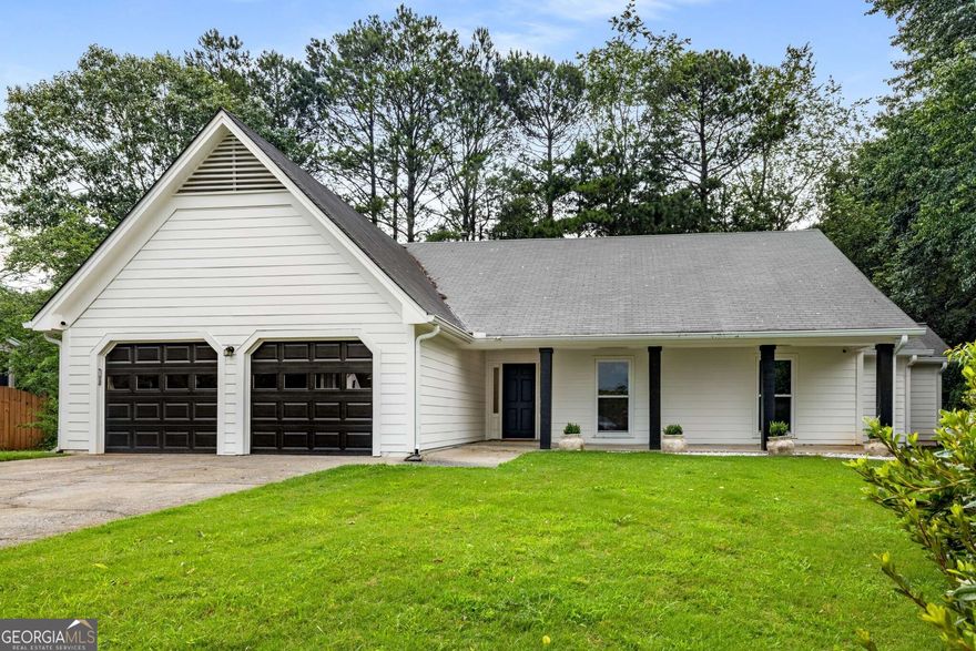 Discover this stunning single-story ranch style home, renovated to blend modern elegance with timeless comfort. The expansive family room welcomes you with soaring ceilings and a cozy fireplace, creating an inviting ambiance. Experience the seamless flow of the open-concept layout, where the main level's high ceilings and abundant natural light enhance the sense of space.  The heart of the home is the breathtaking kitchen, showcasing a massive butcher block island, a professional-grade 6-burner gas stove, and a glamorous walk-in pantry offering unparalleled storage. New flooring, lighting, windows, gutters and fresh paint elevate the entire home, while large new windows frame picturesque views and provide effortless access to a private backyard-ideal for alfresco dining and outdoor entertaining.  This versatile home features three generously sized bedrooms, each with ample closet space, plus a flexible fourth room perfect as an additional bedroom, home office, or recreational space. The master bathroom boasts tiled floors, dual vanities, a relaxing bathtub, and a sleek glass-enclosed shower, creating a spa-like retreat.  Impeccably updated and designed for modern living, this home combines style, functionality, and comfort in every detail.  In addition to the incredible interior space, the home sits on a cul-de-sac in Concord Hall which is part of The Caney Creek Recreational Association (CCRA), a private association serving the recreational and social needs of the Highland Park and Concord Hall subdivisions. The homeowners enjoy the use of facilities all year long, including an Olympic sized swimming pool, 3 tennis courts, basketball court, children's playground, and fully equipped clubhouse. There is an active swim team and multiple tennis teams.  In addition to all that the community has to offer, Concord Hall feeds into top rated North Fulton schools, has easy access to GA 400 and is moments away from Halcyon, which features dining options, boutiques, and access to the Big Creek Greenway.