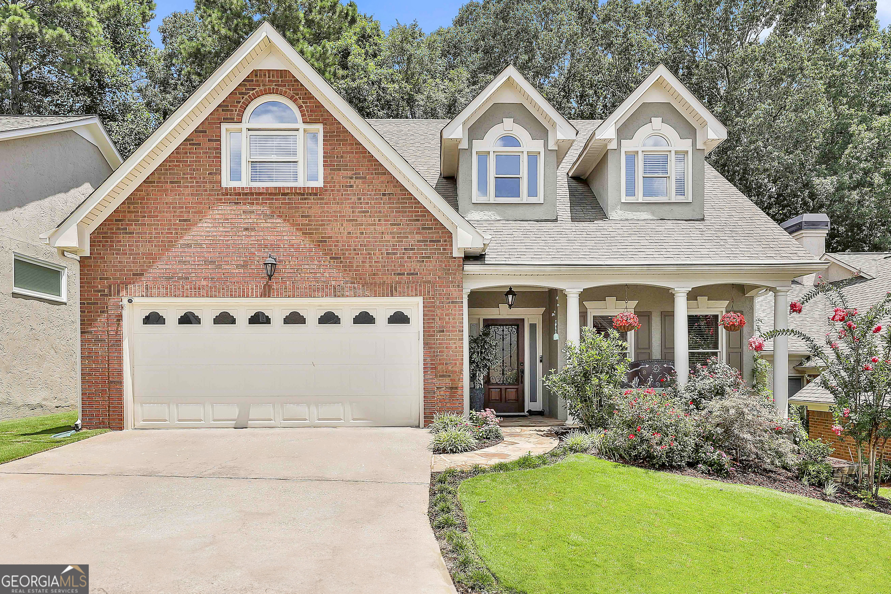***OPEN HOUSE SATURDAY, JULY 26TH, 2:00-4:00*** ABSOLUTELY EXQUISITE DESIGNER SHOWPLACE PERFECTLY SITUATED ON A PREMIER GOLF COURSE LOT WITH BREATHTAKING PANORMIC VIEWS AS FAR AS YOU CAN SEE! Approximately 3350 square feet of pure elegance, renovated to perfection with all the latest trends and decorator touches including gorgeous sunroom, screen porch, and patio additions, all overlooking the 11th hole of Braelinn Golf Course! This incredible open flowing plan features stunning 21' ceilings, 2 story great room, dramatic floor to ceiling dual-sided stone fireplace, entertainment size dining, beautiful den/office with rich judges paneling, the ultimate chef's kitchen plus luxurious owner's retreat with amazing spa bath, all on the main level! AND THAT IS JUST THE BEGINNING...The kitchen is truly the center of this home...totally remodeled with handcrafted cabinetry, granite counters, wine/coffee center, decorator backsplash, soft close drawers, roll out shelving and, new upscale appliances including a Bosch dishwasher, gas range, and top of the line microwave that converts to a convection oven and air fryer too! The elegant primary retreat features a gorgeous spa bath complete with a raised onyx vanity, dual decorator sinks, oversized designer shower with frameless door and dual shower heads, plus two walk-in closets! Take the winding staircase to an open loft or library, wonderful recreation/media room with granite wet bar, huge bonus/teen suite, and guest bedroom too! Lush landscaping and beautiful shade trees create a private "backyard oasis" surrounded by nature and "picture perfect" golf course views! Plenty of outdoor living spaces too... sip your favorite beverage and enjoy the cool fall evenings on your flagstone front porch, vaulted screen porch or patio. Oversized 2.5 car garage with new epoxy flooring will accommodate 2 cars and your golf cart or workshop. Level 2 charging station for electric car has been added for your convenience too! The HOA maintains your yard + trash so you can enjoy a carefree lifestyle, and all Peachtree City has to offer! Prime location connected to 100 miles of cart paths with quick access to shopping, restaurants, International Airport, Trilith, and I-85! NOTHING TO DO BUT MOVE IN AND RELAX! WOW!