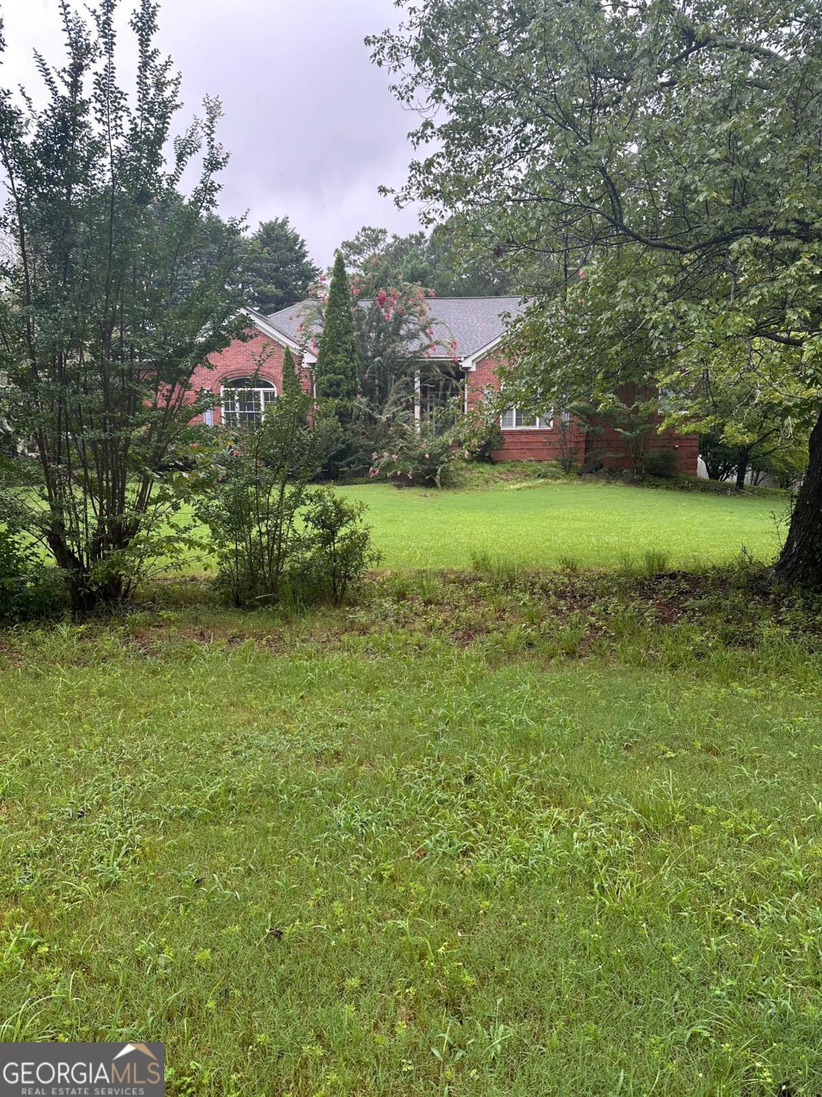 Welcome to your own private retreat! Nestled on over 2.5 acres of serene, wooded land, this stunning 4-sided brick ranch offers timeless charm, modern comfort, and unmatched privacy - all with no HOA restrictions. Step inside to discover a spacious, open floor plan with the primary suite conveniently located on the main level. The home features rich hardwood floors, abundant natural light, and thoughtful updates throughout. Entertain effortlessly in the full finished basement, perfect for a media room, home gym, guest quarters, or all three. Outdoors, you'll find your personal oasis - a beautiful in-ground pool surrounded by nature, ideal for relaxing summers or hosting unforgettable gatherings. The expansive acreage offers room to roam, garden, or simply enjoy the peaceful sounds of nature. Whether you're looking for a private family home, a weekend getaway, or a forever retreat, this property combines comfort, space, and freedom - all just minutes from local conveniences.
