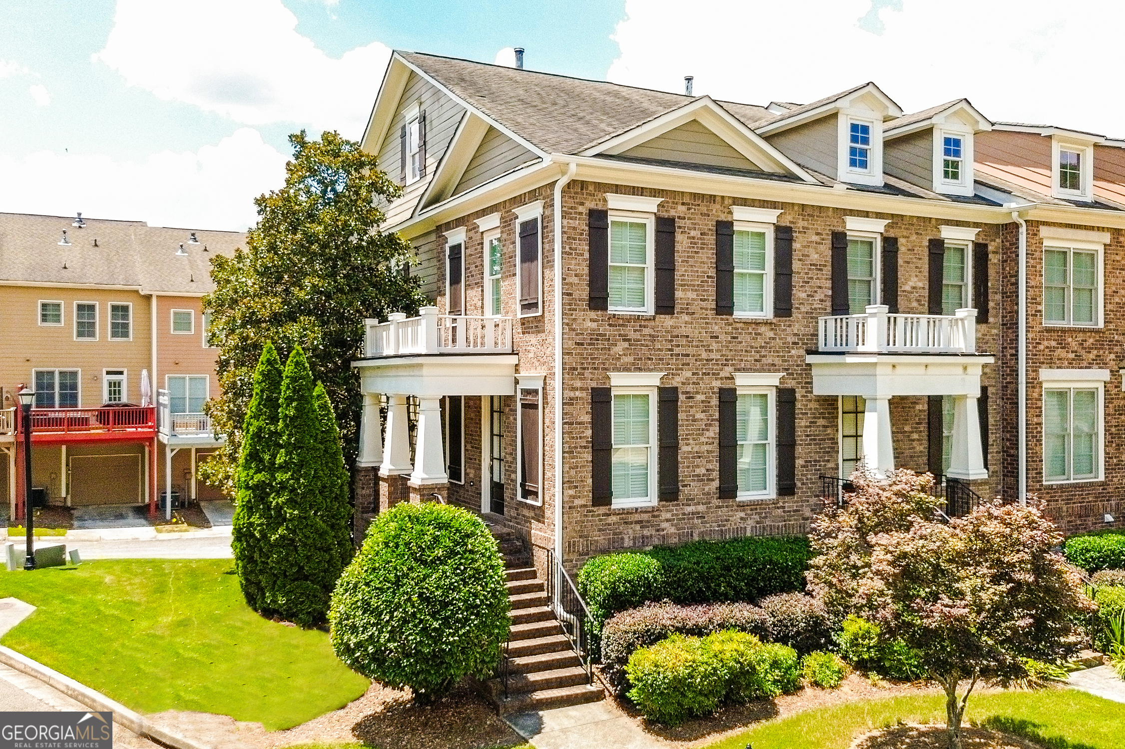 Don't miss this exceptional tri-level townhome built by John Wieland, located in the highly sought-after, gated Providence swim/tennis community. Perfectly positioned near I-285, I-20, Downtown Atlanta, Vinings, Smyrna Market Village, The Battery, Truist Park, and Cumberland Mall, you'll enjoy great proximity to some of the city's best shopping, dining, and entertainment. Inside, this spacious and thoughtfully designed floor plan features a welcoming kitchen with granite countertops, hardwood floors, and a cozy sitting area. Upstairs, you'll find two generously sized bedrooms, each with its own ensuite bath. The terrace level offers a third bedroom and full bath perfect for guests, a home office, or flex space. Step outside to a large deck, ideal for relaxing or entertaining. With charming details throughout, all that's left to do is pack your bags and settle into a lifestyle of comfort, convenience, and timeless appeal.