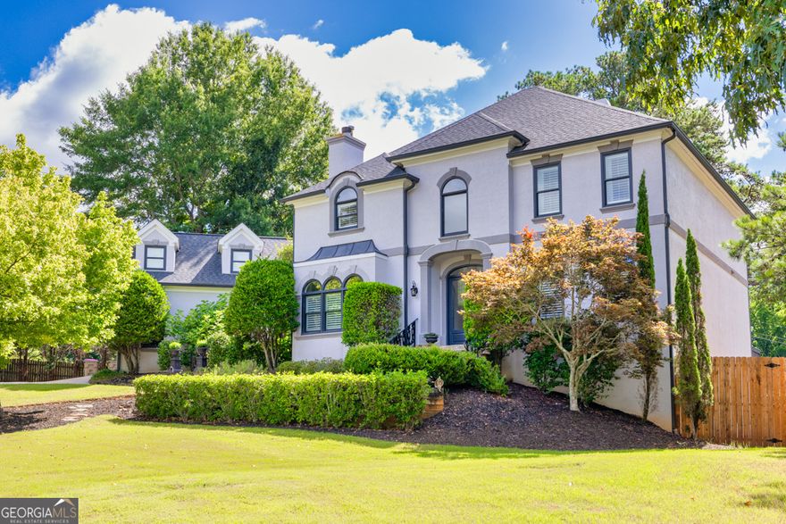 The search for your dream home is over with this beautifully remodeled and generously sized home on a full basement within a cul-de-sac on just under an acre, located in one of the most highly sought after educational areas of Johns Creek. Side entry 2 car garage, mature landscaping, desirable exterior colors, flagstone steps, and an elegant double door entry. Radiant 2 story foyer, HARDWOOD floors, extensive trim work, plantation shutters, columns, arched doorways, and tall palladium windows for a bright open and airy feel throughout the main level. Enormous formal dining room with a fireplace and a CUSTOM 13 foot dining table seating up to 16 people in order to host all of your loved ones no matter the occasion. Feel like your own personal CHEF in the gorgeous kitchen featuring high-end appliances that include a touch screen refrigerator, wine cooler, vent hood, and a 6 burner 48 inch THERMADOR dual fuel range with griddle. Custom cabinetry along with a custom pantry allowing you to easily store your small appliances. The 12 foot GRANITE ISLAND provides extra dinning space perfect for entertaining or enjoying cozy meals. With fall around the corner you won't hesitate to welcome the cool breeze as it flows through the sliding back doors leading to the covered patio and courtyard areas featuring seasonal foliage, a mounted TV, and a ceiling fan. Two story family room shows of a lovely fireplace and built-ins to display some of your finest novelties. Rounding out the MAIN LEVEL is the spacious remodeled PRIMARY SUITE complete with a French door entry, frameless glass shower with dual shower heads, double vanity, freestanding soaking tub, custom closet system, and HEATED FLOORS within the bathroom for those chilly months. Upstairs you'll find a large ON-SUITE, two additional bedrooms which share a jack and jill bath, along with an oversized REC ROOM with luxury vinyl flooring. The abundance of space and storage allow you to customize each room to fit your lifestyle. Did I mention the interior has been freshly painted! Expansive unfinished basement has been framed out with electrical and stubbed for a bathroom, ready to be finished and designed to your liking. Two entrances and a single garage entry for additional storage or added entertainment space. The LEVEL fully FENCED backyard provides endless opportunities to create your dream outdoor oasis. Lots of space for a pool and you'll be enjoying the fire pit in no time! Optional HOA allows you access to the Olympic style pool complete with a diving board. Basketball court, playground, and multiple lighted tennis courts. Nearby highly rated schools, local community events, shopping and dining options, as well as major highways for an easy commute. Schedule a visit today and see for yourself!