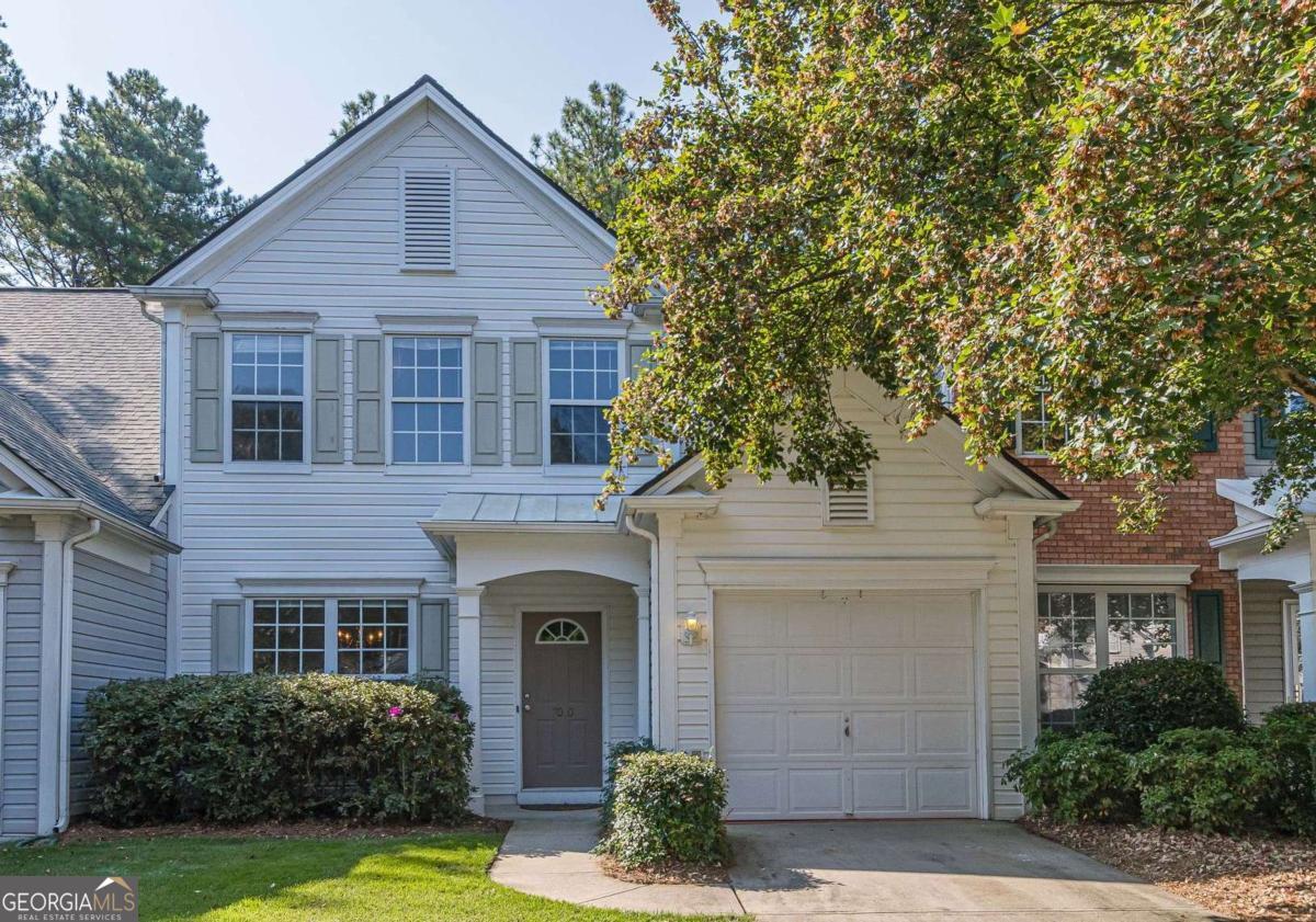 Welcome to this inviting 3-bedroom, 2.5-bath townhouse - the perfect blend of comfort and convenience! Seller is offering up to $5,000 in Buyer Incentives - use it for closing costs, a rate buy-down, or other expenses to make your move even easier. Truly move-in ready - just unpack and start enjoying your new home. You'll love the bright, modern kitchen featuring white cabinetry, sleek New Quartz countertops, and Newer appliances. The open-concept layout flows from kitchen to dining area to a cozy living room with a charming fireplace * New LVP flooring on main level - perfect for everyday living and entertaining. Retreat to a spacious primary suite with dual vanity, nice walk-in closet, separate shower, and a relaxing soaking tub. Two spacious secondary bedrooms, laundry room and full bath complete the upper level. Attached garage in front and patio in back. Following major updates already done for you: New LVP flooring (2025), New Granite Counter Tops & Sink (2025), New HVAC (2021), New roof (2021), New water heater (2022) and recent paint refresh. Enjoy a prime location just minutes from GA-400, downtown Roswell, Alpharetta, Big Creek Greenway, Fulton Science Academy plus other desirable schools and fantastic Dining and Shopping. The HOA covers all of this - pool, water, sewer, exterior grounds, termite protection, and trash service - offering low-maintenance living at its best.