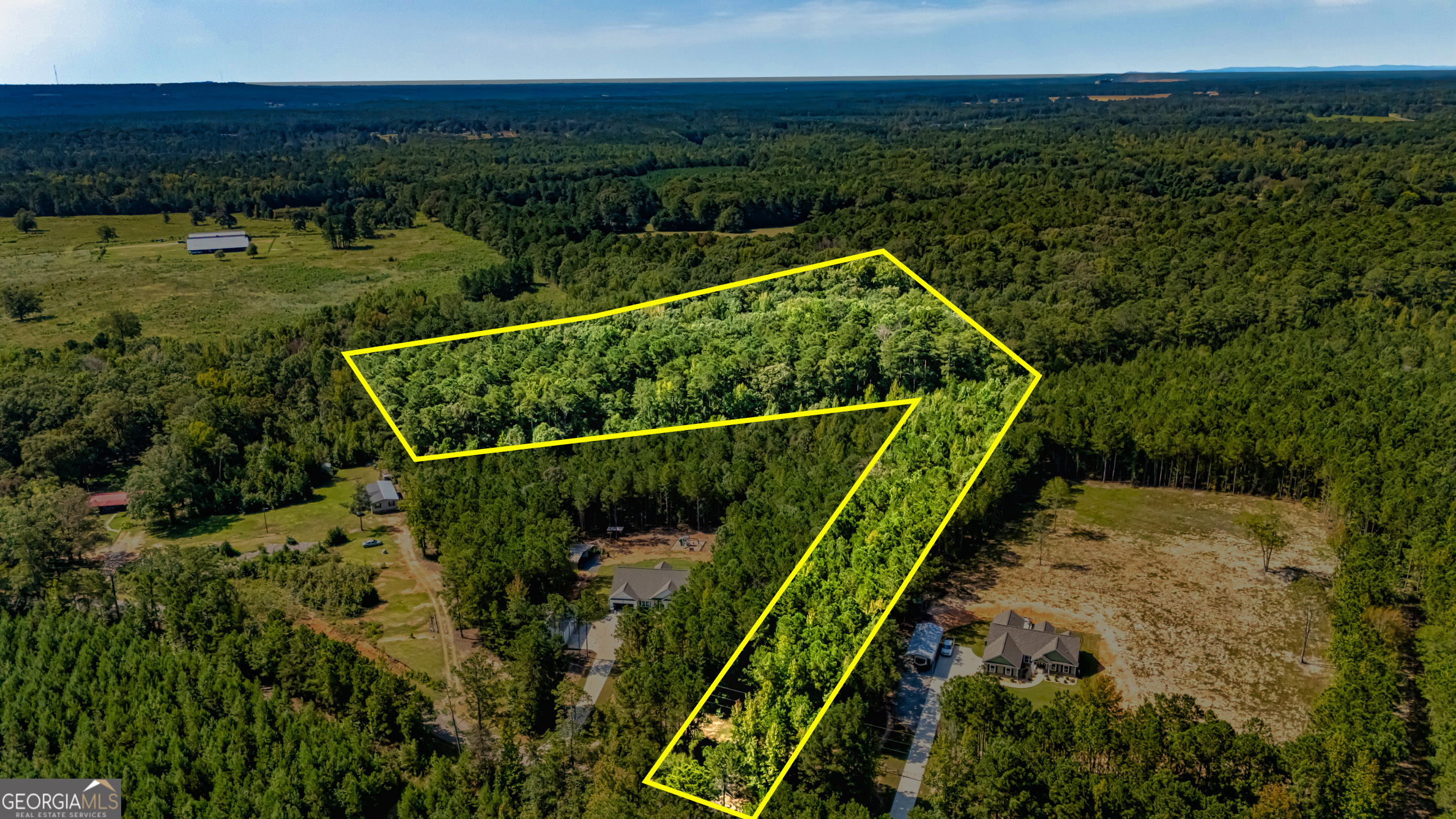 Check out this 10.02 Wooded Track. Ready for you and your builder. This property offers seclusion but also convenience. Located just minutes from interstate 75, downtown Milner and Barnesville. Sellers loss (due to relocation) is your gain.
