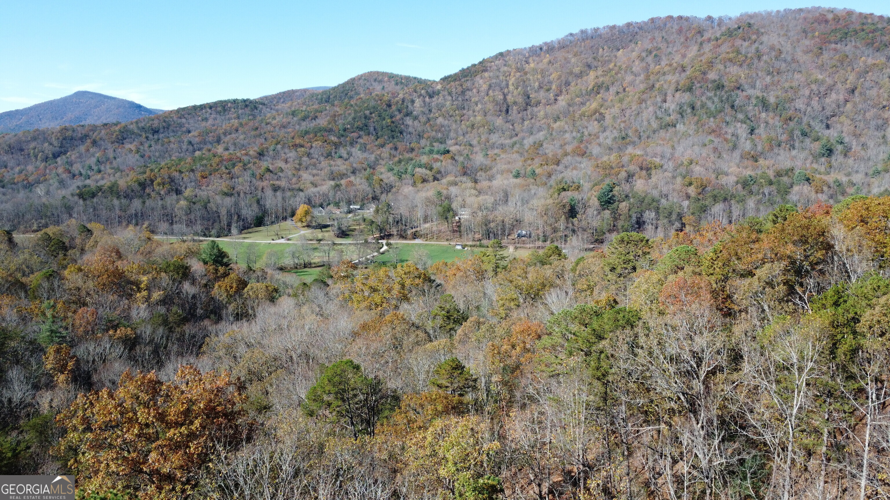 Discover the perfect blend of privacy and convenience with this remarkable 12.84-acre property in the sought-after North Georgia Mountains. Nestled near the pristine shores of Lake Burton, this undeveloped land offers a blank canvas for your dream home or getaway retreat. Surrounded by nature's tranquility, you'll enjoy seclusion while still being conveniently located near outdoor adventures, charming mountain towns, and local amenities. Bring your building plans and make your vision a reality in this highly desirable area. Don't miss this rare opportunity to own a slice of paradise!The adjoining parcel is also available MLS#10414228.