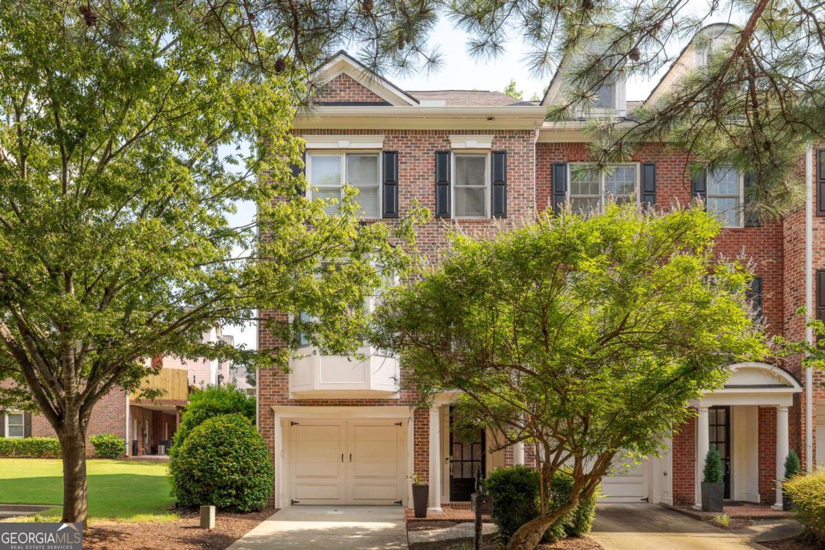 Exceptional opportunity in a resort-style community, just minutes from vibrant downtown Roswell! This home spans three levels of living space. Upon entering, you'll find a versatile area that can serve as a home gym, media room, office, teen suite, in-law suite, or a third bedroom, complete with a full bath and its own separate heating and air conditioning zone. The main floor features a spacious family room with a cozy fireplace and custom built-in bookshelves. Natural light pours in through large windows fitted with plantation shutters. The charming eat-in kitchen, boasts upgraded white quartz countertops, white cabinetry, and stainless steel appliances. Upstairs, the oversized primary suite offers a vaulted ceiling for an open, airy feel. The en suite bathroom includes a double vanity, a separate soaking tub, and a shower. This level also features a generously-sized laundry room and a large second bedroom with its own full bath. The community amenities include a resort-style pool, a lap pool, tennis courts, a clubhouse, a fully-equipped gym, lush green spaces, and scenic walking trails. Walk to HomeDepot, Target, Trader Joes, and Starbucks. Do miss this opportunity to live in one of Roswell's best gated townhouse communities!
