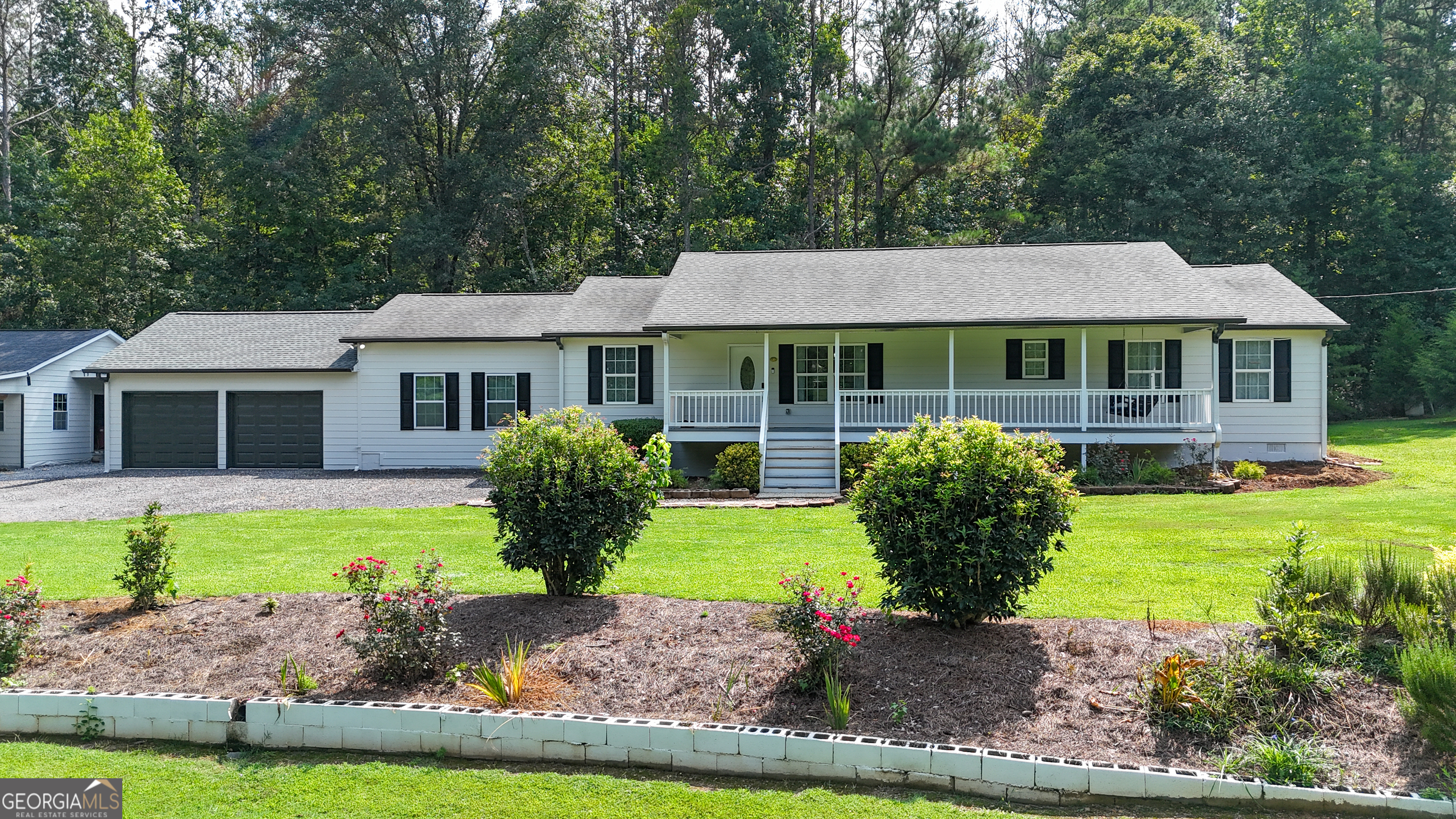 Enjoy peace and tranquility with your morning coffee on the porch swing, or unwind at the end of a long day while taking in the view of a beautiful, well-maintained yard. This charming home offers 3 bedrooms and 2 full bathrooms and was built in 2015, reflecting pride of ownership and a love for nature. With 2,147 square feet of living space, there's room to relax and entertain - plus ample outdoor space to park your RV, boat, or store your other toys and work equipment. Located in Cartersville, a town that strikes the perfect balance between small-town charm and big-city convenience, you'll enjoy a growing job market, great schools, and a vibrant community. And when you're ready to explore, you're just a short drive from Lake Allatoona, Red Top Mountain State Park, and Pine Mountain.