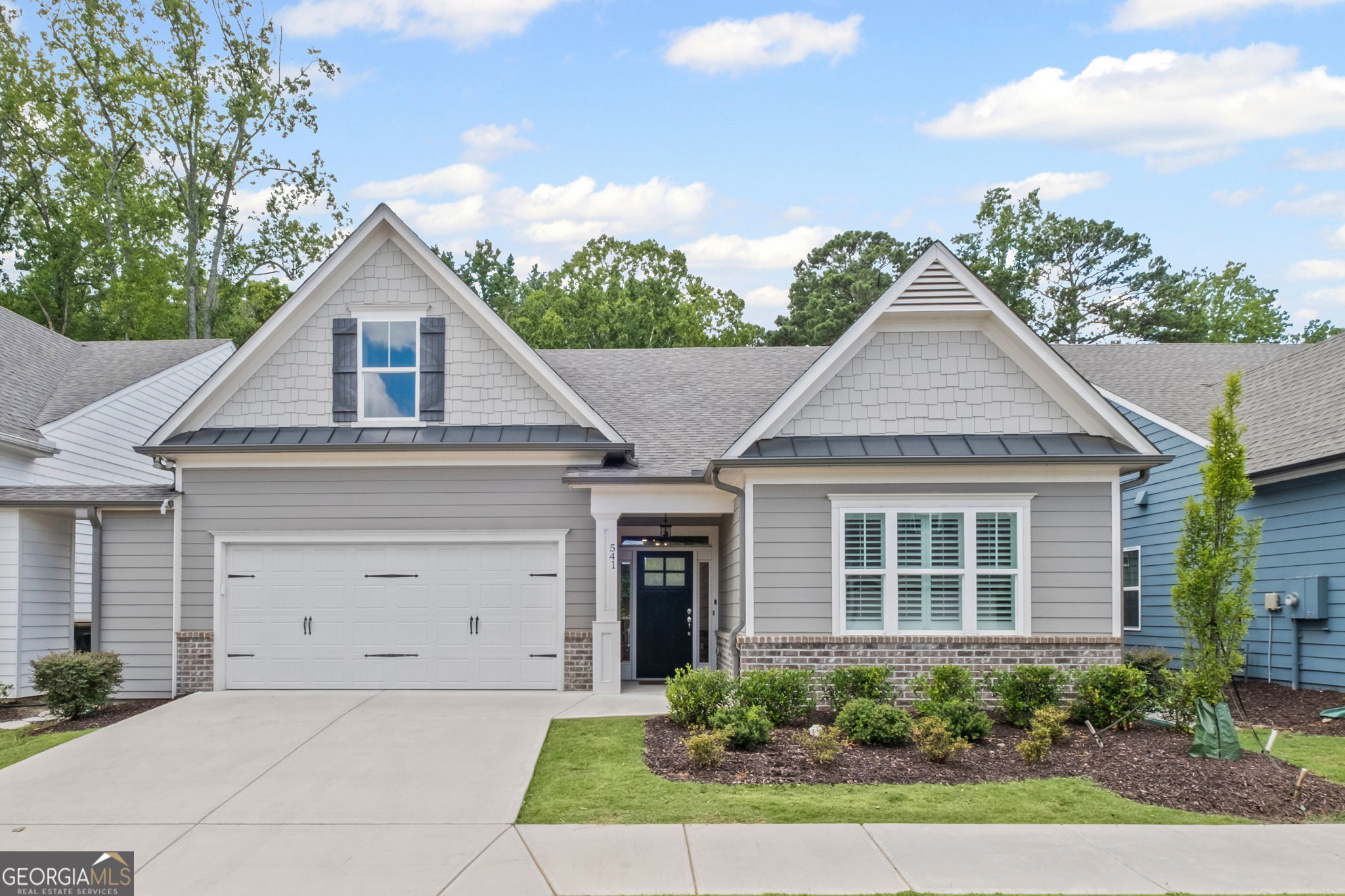 This is one-level living at its best in one of the truly step-less homes in Villas at Presley Lake. If you're seeking a home in immaculate condition with a like-new feel, don't miss this opportunity. The open floor plan and 10-foot ceilings create a spacious living area. The primary suite, which includes a custom walk-in closet, is located at the back, offering an unobstructed view of the woods behind the home and a sense of privacy. This same view can be enjoyed from the sun porch addition. The kitchen features a large island, plenty of counter space, and a walk-in pantry. Appliances are Energy Star certified. Lawn maintenance is taken care of by the HOA. The location is unbeatable with easy access to downtown Woodstock, I575, and it's not far from downtown Roswell.