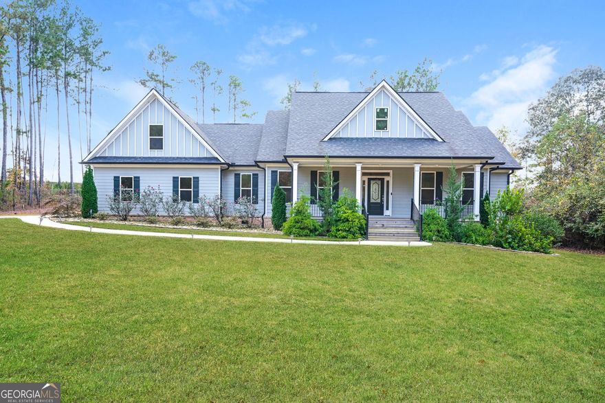 Located at 450 Kelleytown Road, McDonough, GA, this residential property in Henry County presents an attractive opportunity to own a home built in 2020 that is in great condition. The living room serves as a central gathering space, showcasing a fireplace that adds warmth and character, complemented by a beamed ceiling, coffered ceiling, and crown molding which elevate the architectural detail, while built-in shelves offer both functionality and a place to showcase treasured items. The kitchen is designed for both culinary exploration and social interaction, featuring a large kitchen island that provides ample workspace and a gathering point, a custom range hood that makes a statement, stone countertops that provide a durable and elegant surface, shaker cabinets that offer a timeless aesthetic, crown molding that adds a touch of sophistication, and a kitchen bar for casual dining or entertaining. The bathroom provides a spa-like experience with its double vanity that offers convenience and space, a tiled walk-in shower that exudes luxury, and a soaking tub that invites relaxation and rejuvenation. The bedroom provides a comfortable retreat, enhanced by crown molding that adds a touch of elegance. Additional features include a porch where you can relax and enjoy the outdoors. This 2830 square foot property offers a blend of modern living and timeless design.