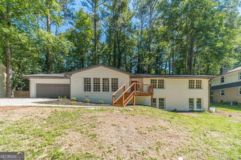 Photo of 664 Hickory Ridge Road SW, Lilburn, GA 30047 (MLS # 10780490)
