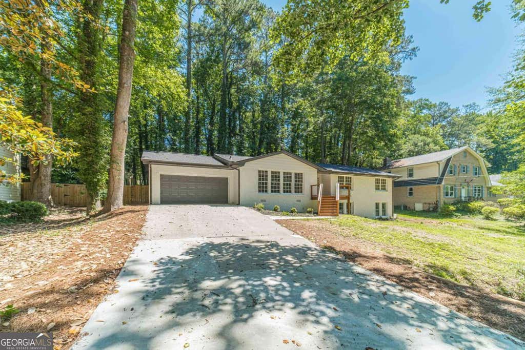 Photo of 664 Hickory Ridge Road SW, Lilburn, GA 30047 (MLS # 10780490)