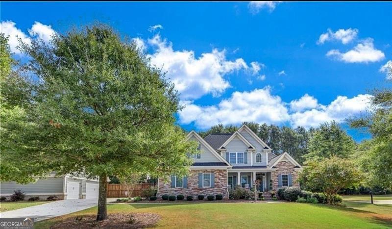 Updated home in North Oconee School District with Detached Flex-Living Space and four car garage. Many renovations done one year ago, including hardwood floors throughout the home, Fully renovated laundry room, kitchen and Owner's bath. All featuring Quartz countertops. Custom built-in storage in owners suite bedroom and closet, new paint throughout home and all new lighting. This home is in the conveniently located pool & sidewalk community of Harperfield and features living and entertaining areas including a large, private fenced back lawn and fire pit. The owners suite is on the main floor. Upstairs features 3 additional bedrooms, one with a private bathroom and two other large bedrooms plus another full bath. Come home to Oconee County to award winning schools & community. Close access to schools, shopping & Hwy 316 & 78 for easy commute!