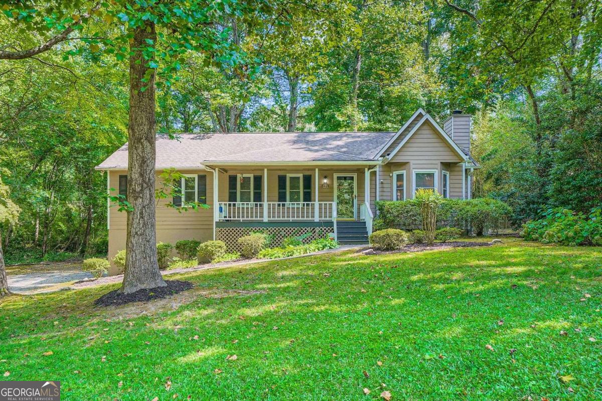 Ideally located just minutes from the East-West Connector, top shopping, dining, and everyday conveniences, this charming Marietta home offers spacious living across multiple levels. With 3 bedrooms and 3 full bathrooms, the home features a thoughtfully designed floor plan that includes a finished basement with a versatile recreation or bonus room, a laundry closet, and a full bath with a tub/shower combo-perfect for guests, a home office, or media space. Enjoy a rocking chair front porch, a private fenced backyard, a wood deck, and a screened-in sunroom, ideal for relaxing or entertaining in any season. Inside, the living room welcomes you with vaulted ceilings and a tile-faced fireplace, while the open-concept kitchen and dining area provides a natural flow for everyday living. The primary suite features double tray ceilings, a frameless glass shower, and a modern, spa-like feel. Additional highlights include a hot water heater replaced just 2 years ago, offering peace of mind and added value. A perfect blend of comfort, character, and convenience-this home is a must-see in one of Marietta's most accessible locations! Discounted rate options and no lender fee future refinancing may be available for qualified buyers of this home. This house is priced to sell and move in ready!