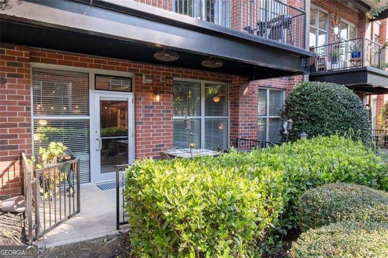 Why settle for ordinary when you can have a condo that checks all the boxes? This fully renovated gem puts you right in the heart of downtown Chamblee-feet from restaurants, shopping, and even the new Chamblee Rail Trail (hello, accessible lifestyle goals). Inside, you'll find soaring ceilings, floor-to-ceiling windows, and an open floor plan that feels bright, airy, and downright Instagrammable. The kitchen? Way above "condo standard"-with shaker cabinets, granite counters, stainless appliances, pantry storage, and a massive breakfast bar. Bonus points: a custom wine bar with reclaimed wood, a wine fridge, plus additional storage. The living room has all the space you need for your big sectional and your oversized TV-aka game day central. Head outside to your covered, fenced-in patio that's great for pets, lounging, or pretending you have a yard without the lawn care. The primary suite easily fits a king bed, plus you get a dreamy walk-in closet and a renovated spa-like bath with a walk-in shower. Guests won't feel left out either-the second bedroom comes with its own walk-in closet and ensuite bath, also beautifully renovated. The perks don't stop at your front door: this gated community features a gym, green space, and a dog park. You're also minutes from MARTA, Whole Foods, antique shops, trendy restaurants, and local bars. Bottom line: This isn't just a condo-it's a lifestyle upgrade.