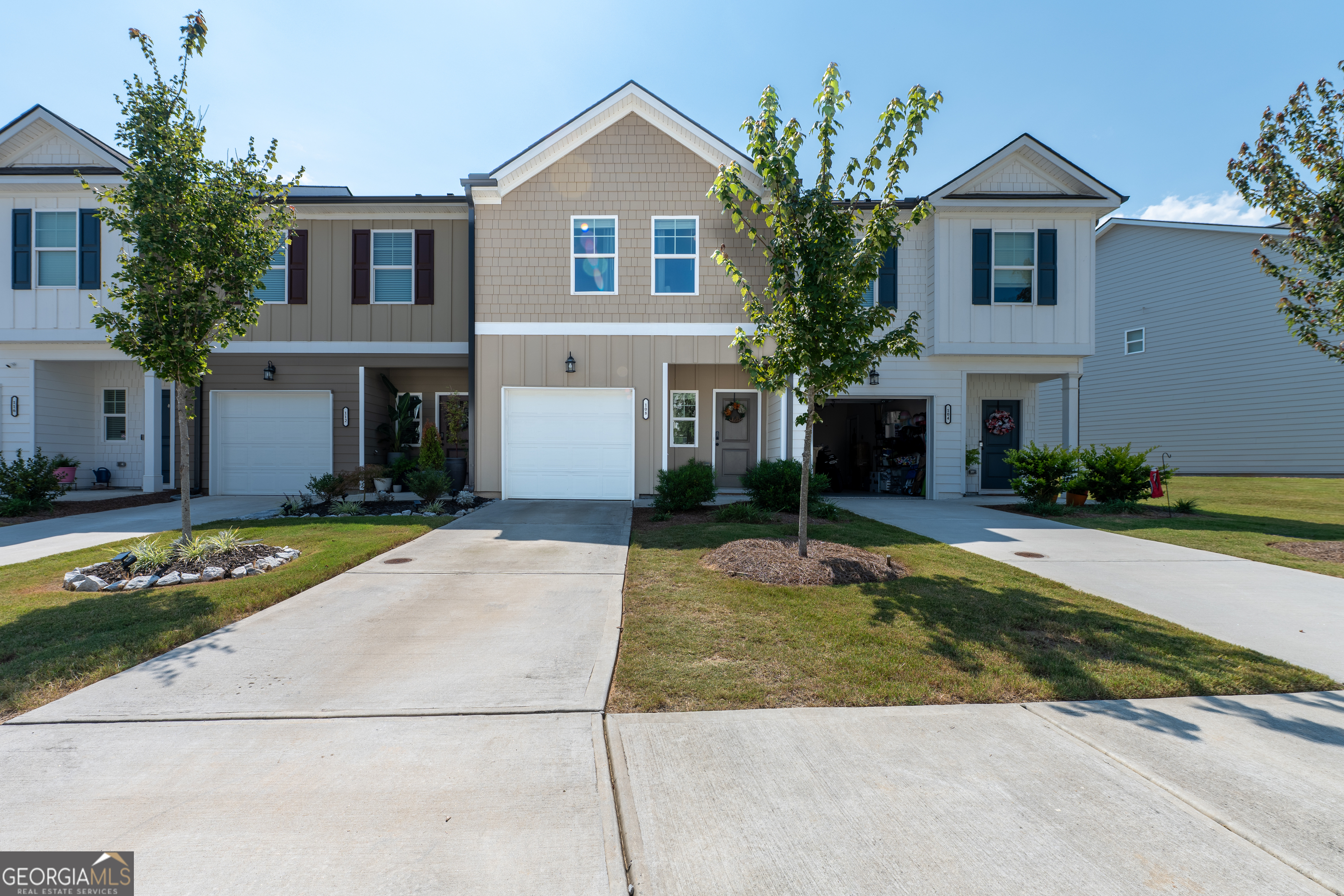 Charming 3-bedroom, 2.5-bath home in the heart of Hoschton, just steps from Hoschton Cafe. The open-concept main level features LVP flooring, a kitchen with granite countertops, ceramic tile backsplash, and stainless steel appliances overlooking the family room and dining area. Upstairs, the oversized Owner's Suite offers a separate tub and shower, dual vanity, and walk-in closet, with two additional bedrooms and laundry room completing the level. Enjoy community amenities including a pool and cabana. Explore nearby boutiques in Old Town Hoschton and relax at Chateau Elan Winery & Resort.