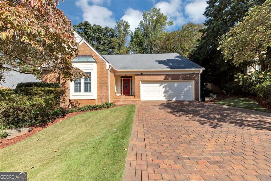 This beautifully renovated brick home in East Cobb's prestigious Woodhaven subdivision combines timeless design with modern sophistication. Located in one of Georgia's most sought-after school districts, Sope Creek Elementary, Dickerson Middle, and Walton High, this property offers luxury living in an unbeatable location. Step inside to find custom hardwood stairs and banister, elegant lighting, and new designer paint throughout. The expansive great room features rich hardwood floors with matching in-floor ventilation and an open layout created by the removal of the engineered separation wall. The primary suite on the main level is a serene retreat with dual Elfa-customized closets and a marble and hardwood spa bathroom featuring a six-function steam shower, aromatic air-jet soaking tub, high-efficiency toilet, and private stairway to a flexible office or closet space. The chef's kitchen showcases marble flooring, double quartz countertops with built-in outlets, marble backsplash, prep sink, multi-function filtered water system, built-in pot filler, and a butler's pantry with wine rack. A newly added half bath with pocket door separation adds convenience and style. Enjoy the sunroom with natural slate flooring, overlooking a fully resurfaced pool with new electrical, Bluetooth lighting, upgraded filtration system, resurfaced deck, and new paver stones, perfect for year-round entertaining. Upstairs, two spacious bedrooms feature updated lighting, ceiling fans, and fresh paint, each with newly designed bathrooms offering dual sinks, designer tile, and dual adjustable shower heads. One bedroom includes a mirrored secret door to the primary flex space, while the other enjoys a private water closet. The finished basement provides multiple living spaces and a newly renovated full bath with a designer marbled shower and tall ceilings, ideal for guests or recreation. Every inch of this home has been meticulously upgraded, from electrical and lighting to flooring, paint, and custom storage, creating a move-in ready masterpiece that blends luxury, comfort, and craftsmanship. Conveniently located near East Cobb's premier shopping, dining, and parks, this home offers the perfect balance of elegance and everyday ease.