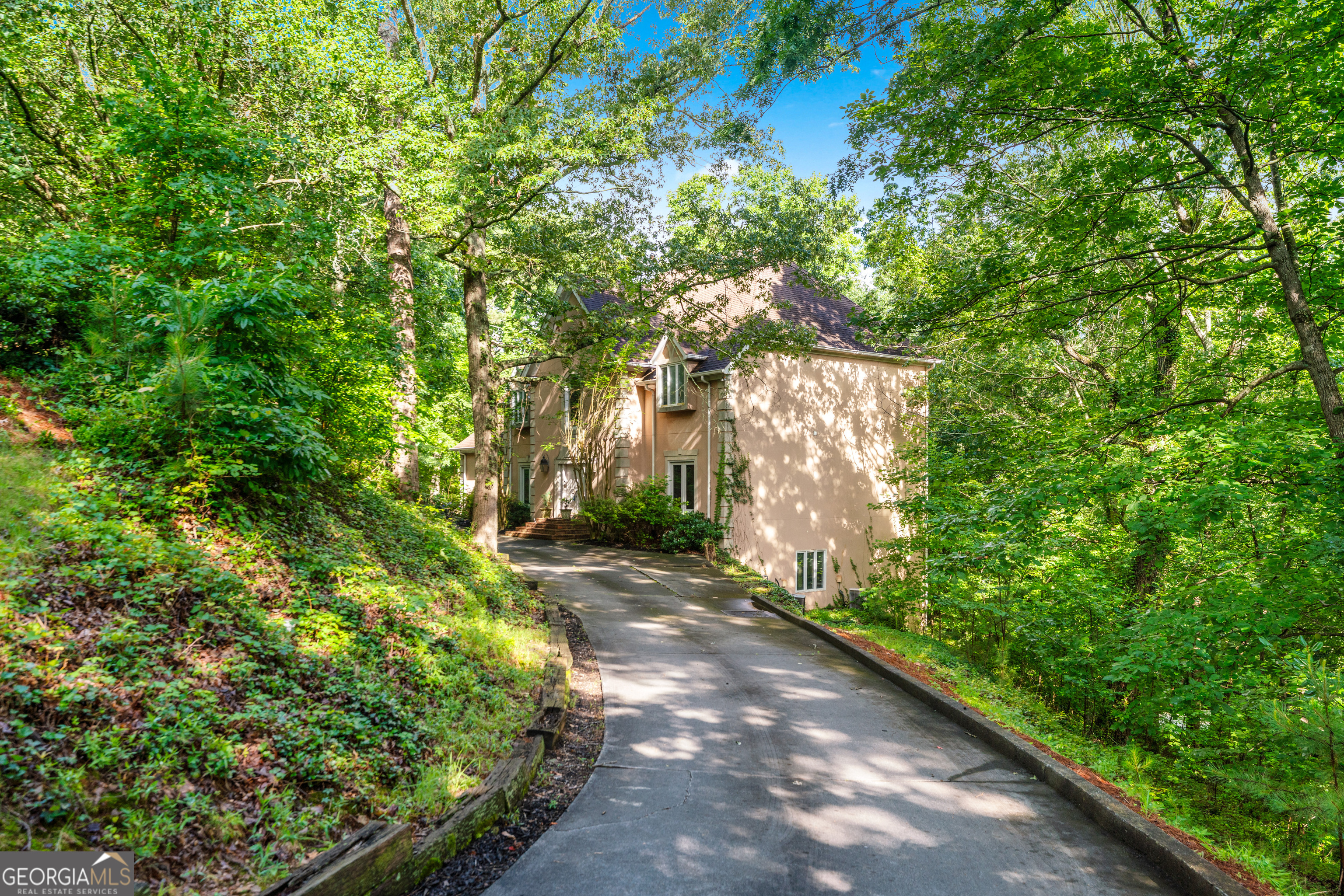 Experience Everyday Luxury in This Stunning Sandy Springs Retreat! From the moment you step into the grand marble foyer, you're welcomed into a world of elegance, warmth, and refined living. Rich hardwood floors flow throughout spacious living areas, setting the tone for comfort and style. A main-level guest suite offers the perfect blend of privacy and hospitality, ideal for overnight guests or multigenerational living. The gourmet eat-in kitchen is a chef's dream, featuring solid surface countertops, custom cabinetry, and high-end stainless steel appliances. Massive windows fill the home with natural light and frame tranquil, tree-lined views, turning every meal into a serene, elevated experience. Upstairs, the primary suite is a true sanctuary. Unwind in the luxurious sitting area, enjoy the spa-inspired en-suite bath with a soaking tub and separate shower, and take advantage of an expansive walk-in closet that's as functional as it is indulgent. Adding to the charm, one of the oversized bedrooms includes a fun, built-in loft, a perfect kids' hangout or creative nook, designed for play, reading, or imaginative adventures. Lovingly maintained by a single owner and never before offered for sale, this home has a unique charm and warmth that only time and care can create. While it offers tremendous quality and craftsmanship throughout, a touch of updating could transform it into your dream space, an exciting opportunity to make it truly your own. The full, finished basement provides a wealth of possibilities, ideal for a home theater, entertainment lounge, gym, or recreation space, crafted for effortless luxury living. Step outside and you'll discover three tiers of balconies, each offering the feel of private treetop terraces with unmatched privacy and peace. The top deck is a secluded sanctuary, while the resort-style in-ground pool delivers the perfect touch of indulgence and summer fun. Charming architectural details like built-in window seats, oversized front bedrooms, and light-filled interiors bring warmth and personality to every corner of this stately home. Set in a quiet, upscale neighborhood of beautifully maintained properties, this exceptional residence offers the perfect blend of serenity and convenience, just minutes from everything North Atlanta and Sandy Springs have to offer. This is luxury living at its finest, uniquely elegant, thoughtfully lived-in, and ready to welcome its next chapter. Don't let this rare gem slip away. Schedule your private tour today!