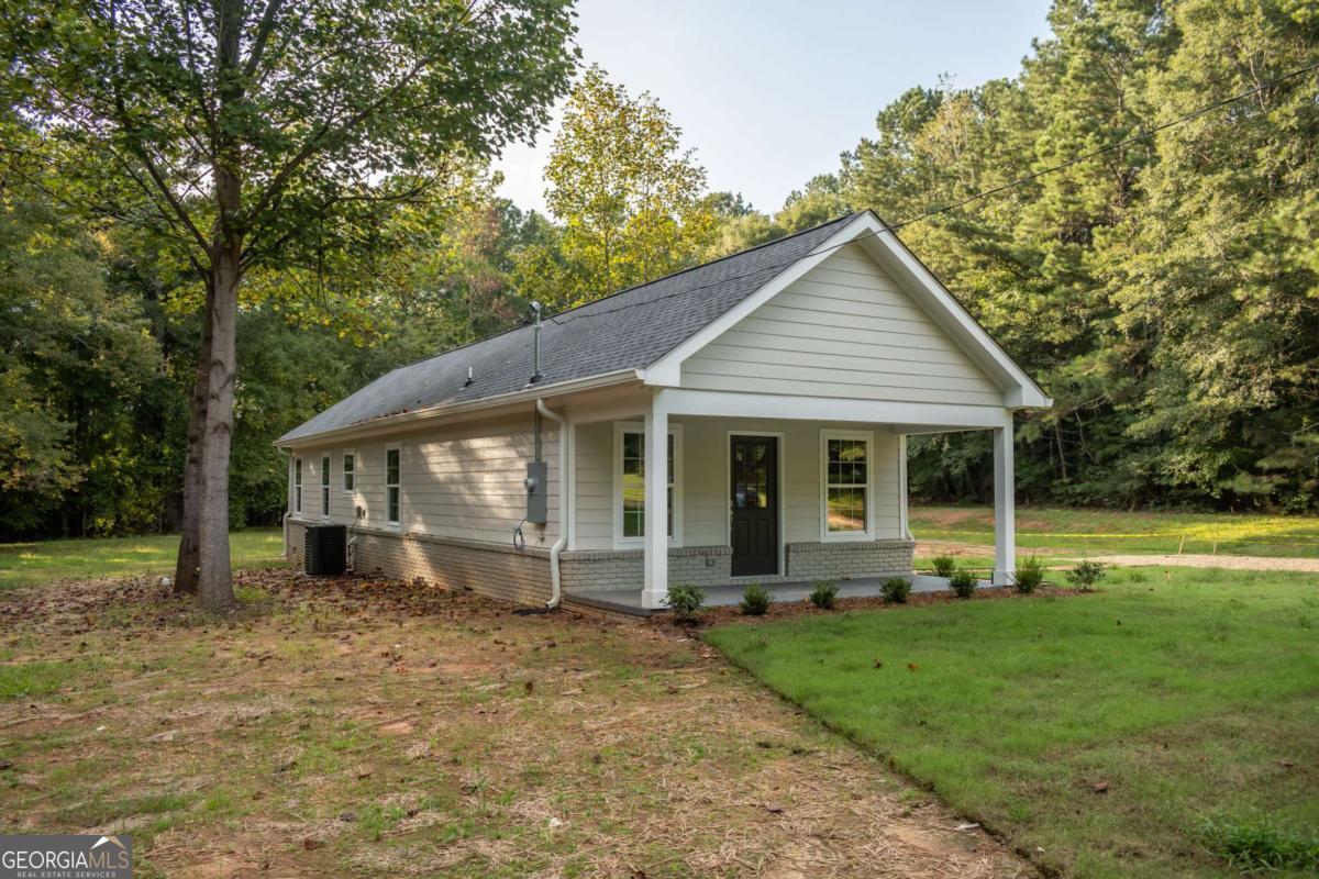 Life on the Fire Fly trail! Completely remodeled two-bedroom 2-bath home situated on 1 acre. As you enter the home, you will be welcomed into the large living room. Just past this will be the separate dining room adjacent to the new kitchen. With sold surface countertops, new cabinetry, brand new stainless steel appliances, and a pantry. The rear of the home is the main level owners suite that has a walk-in closet. In addition to this, there is a private exit to the covered rear porch. This is a beautiful space for relaxation and a big cup of coffee. Located on a one-acre lot, this home and property have plenty of potential for future expansion. Did we mention that it was directly across from the Fire Fly trail and near shopping and the loop? Perfect location in Winterville.
