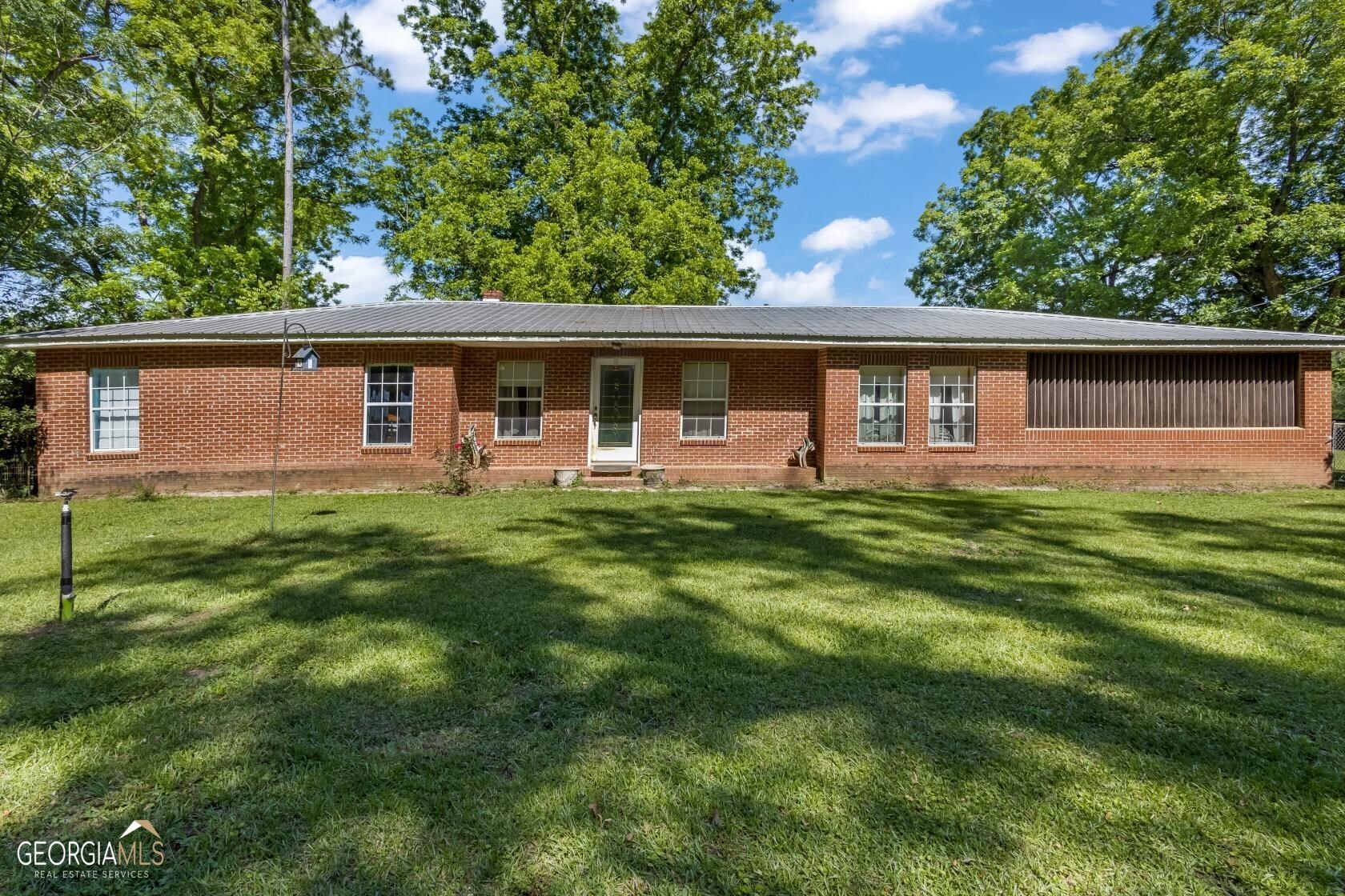 Over 19 acres of privacy and peaceful living awaits you! This all brick, classic ranch home sits on 19.2 acres of beautiful property and lives large and open! With the perfect flow from the kitchen, to dining, to the living room, there's plenty of room for the whole family when you want to entertain. The kitchen has loads of counter space for prepping meals and there's a pantry for additional storage. Each bedroom is a great size and the bathrooms are absolutely immaculate. Be sure to check out the storage and function of the mud room - perfect for storing and tucking away your boots and hats! This property has been well loved, well taken care of, and is sure to not disappoint! Property boarders Turkey Creek Plantation with an abundance of deer, turkey, and wildlife. Has a fishing pond with a dock, fenced, cross fenced, and pasture for cattle, goats, and horses. Round pen, pole barn, and nice chicken coop.