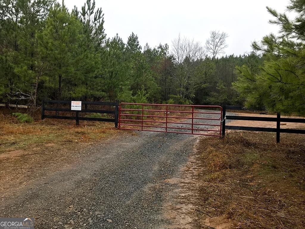 Flintlock Woods Hunting Tract spans 213.24 acres of Georgia countryside. This unrestricted large acreage is full of wildlife and with miles of cleared trails, it's ready for hunting season. Bring your RV and side by side, horses or cattle, and live where you farm and hunt - or just visit on the weekends. This property has an abundance of mixed hardwoods and is located in a quiet secluded area surrounded by farms and large home sites. With easy access from the paved county road, take the farm gate entrance into the property and follow the cleared trails for a grand tour. This tract has lots of deer and turkey on the property and feels like your own forest! With power and water at the road and no restrictions, make Flintlock Woods your dream hunting getaway.