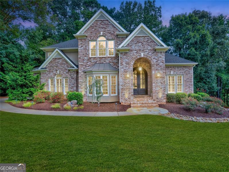 East Cobb/Roswell Luxury Living - Welcome to this stately 5-bedroom, 5.5-bath residence in the highly sought-after Park at Garrison Oaks community in the East Cobb area of Roswell. Built in 2003 and maintained with exceptional care, this 6,461 square-foot home offers a refined blend of classic craftsmanship and modern updates, all set on a private half-acre lot. From the moment you arrive, you'll be captivated by the home's three-sided brick construction and the spectacular double arched steel French doors with inset glass, making a bold yet timeless first impression. A spacious three-car garage provides ample parking and storage. Inside, the main level showcases beautiful hardwood flooring and abundant natural light. The open kitchen is both functional and stylish, complete with granite countertops, stainless steel appliances, pendant lighting, and a bar area overlooking the inviting family room with fireplace. This well-planned layout flows seamlessly into formal and informal dining spaces, making it perfect for both everyday living and entertaining. The owner's suite is truly exceptional. A vaulted ceiling, private sitting area with fireplace, and oversized custom walk-in closet with a 3-way mirror make it a sanctuary within the home. The recently renovated master bathroom feels like a spa, featuring stained glass windows, updated tile, a luxurious walk-in shower, a freestanding soaking tub, and upgraded fixtures. Upstairs, in addition to the master suite, there are three additional bedrooms providing comfort and privacy, each paired with its own bath, ensuring everyone has space of their own. The fully finished terrace level expands the living space with soaring ceilings and endless possibilities. Highlights include a media room, bar area, wine cellar, full bedroom, and full bath-the ideal setup for hosting gatherings, accommodating guests, or creating an in-law suite. In addition, there is a full size dedicated work out room also on the terrace level! Just outside of the main level you'll enjoy the screened-in outdoor dining and sitting areas, designed for relaxation and entertaining. Whether it's morning coffee or evening dinner parties, there is plenty of space. The half-acre lot provides the perfect backdrop. Located in East Cobb, this home is part of the top-rated Lassiter High School district, which consistently earns a 10 out of 10 rating on GreatSchools. The Park at Garrison Oaks is one of the area's most popular neighborhoods, offering both community charm and close proximity to shopping, dining, and parks. Full usage of the neighborhood pool and tennis courts are popular amenities for the neighborhood. This Roswell treasure combines elegance, comfort, and functionality-delivering the perfect setting for both everyday life and unforgettable entertaining. Welcome Home! - Where your story begins!