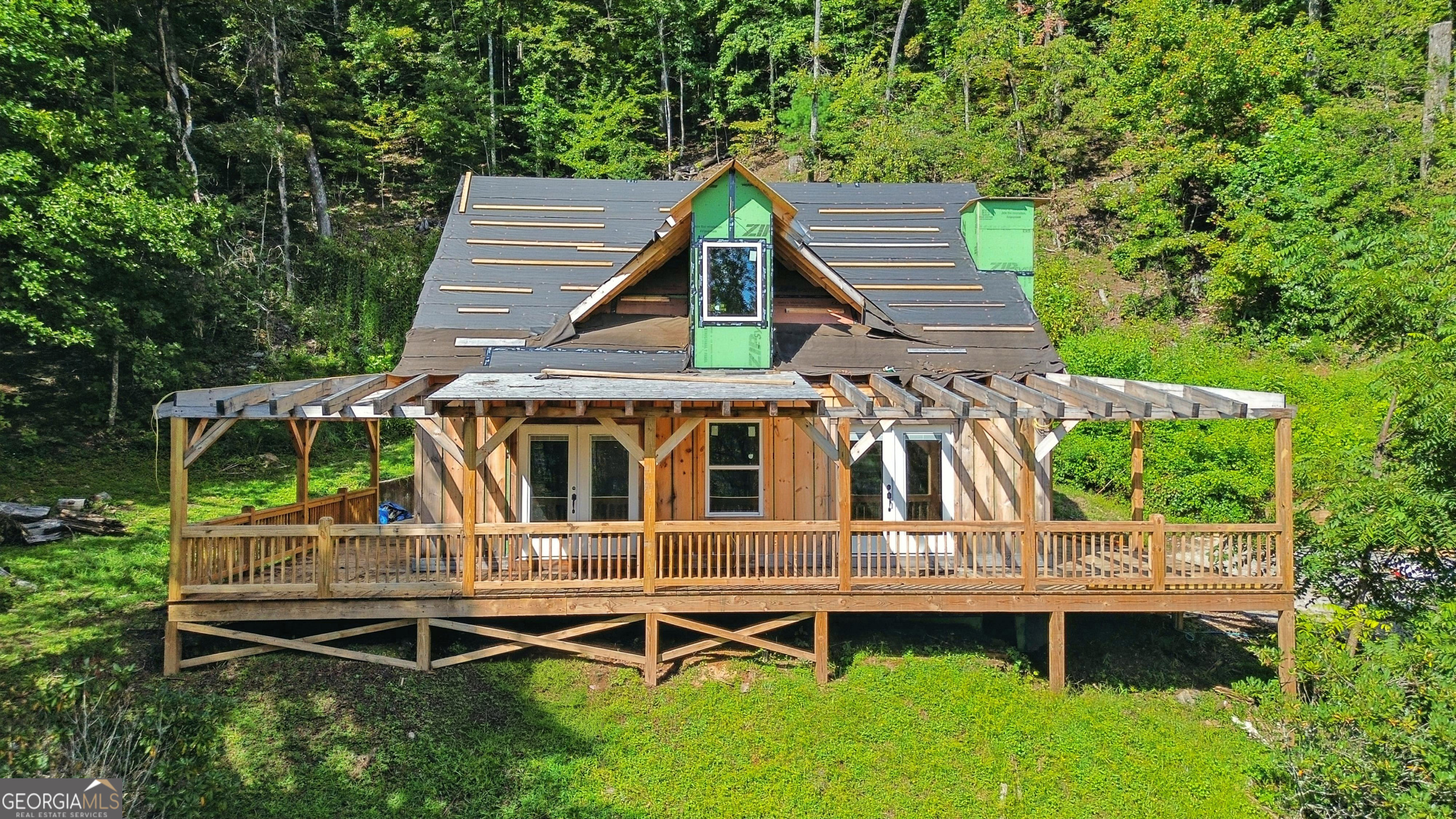 Discover the opportunity to finish your dream mountain retreat! This 2-bedroom, 2-bath home is currently under construction and being sold as is, giving you the chance to make it your own. The property is already equipped with a 4-bedroom septic system, offering future flexibility for expansion. Nestled on 3.6 acres with a pretty mountain view, this property has the potential for both comfort and privacy. Many of the appliances and construction materials needed to complete the home are already on site, saving time and expense as you bring your vision to life. With the foundation set, the hard work started, and the stunning setting already in place, this home is an ideal project for someone looking to create a custom mountain getaway or primary residence.