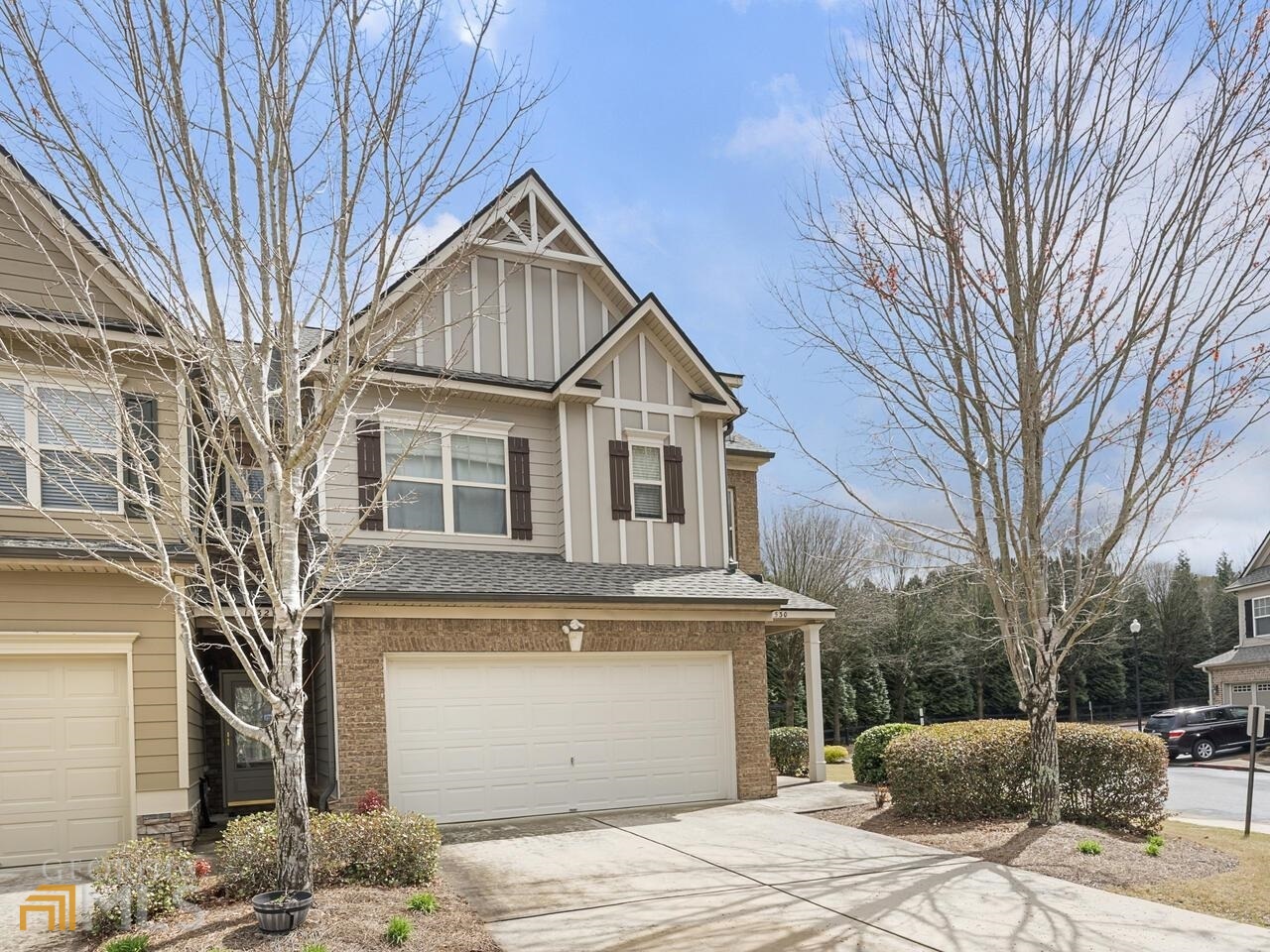 Lovely End Unit Town Home convenient to Shopping and I-75* Hardwood Flooring througout with Newer Carpet on Stairs* Living Room has Electric Fireplace, Wall of Windows and Ceiling Fan* Kitchen has Granite Counters, Stained Cabinets, Stainless Appliances, including Refrigerator and Built In Microwave* Owner's Suite is Spacious and has Trey Ceiling, Walk In Closet, Tiled Bathroom Flooring, Separate Shower/Tub and Double Vanities* This Unit sits in front of Walking Trails and Beautiful Nature Park* 2 Car Garage with Auto Openers. Newer HAVC Serviced Recently* Great Community Pool.