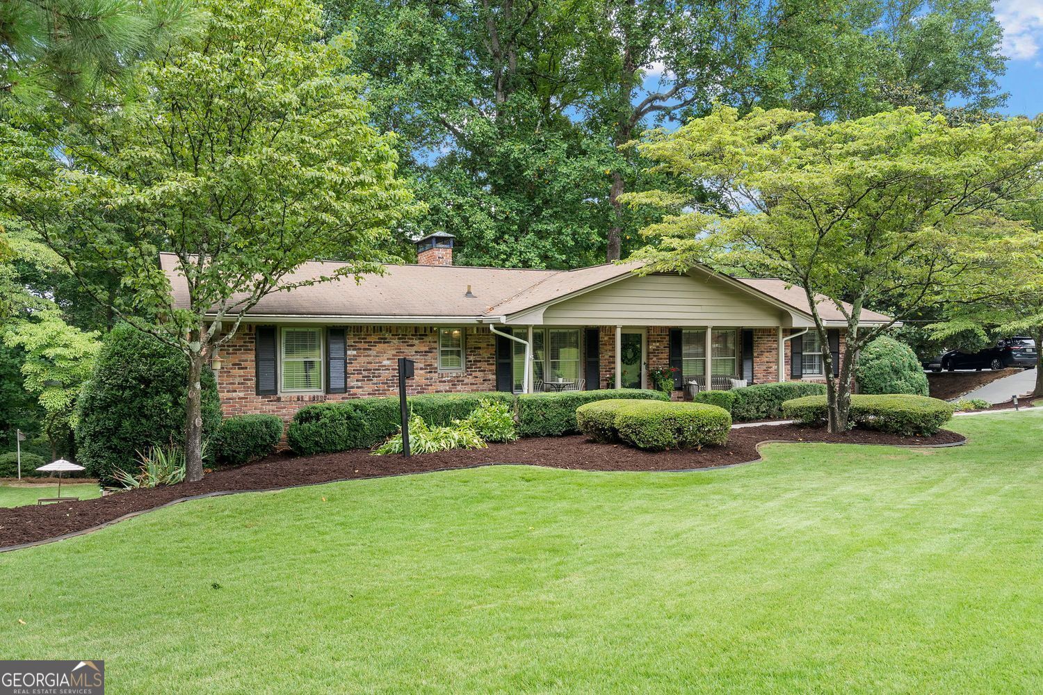 Welcome to the heart of Dunwoody! Tucked into one of Metro Atlanta's most sought after areas, this home offers the perfect mix of suburban living and prime city access. Inside this beautiful four-sided brick ranch style home you'll find a spacious owner's suite with two additional bedrooms and two full baths on the main floor. Enjoy a renovated kitchen with all new cabinets, large new island, refrigerator, and an added pantry which opens to a bright breakfast area. The cozy living and family rooms with two fireplaces offer the perfect place to relax and gather with family and friends. Don't miss the thoughtful improvements throughout this home-including new hardwood floors throughout, stylish new lighting, and fresh interior paint. A renovated secondary bathroom, modern sun blinds, and updated garage doors with power openers are additional improvements. With a welcoming front porch, lush level yard, garden boxes, and a covered deck, this .6-acre lot is your personal outdoor haven-lovingly maintained. The fully finished renovated basement with new laminate flooring is the ultimate flex space - whether you're dreaming of a man cave, home gym, office, movie nights or a playroom with a private exterior entry. No HOA. Just minutes to premier retail and restaurant options in vibrant Dunwoody along with top-rated schools, Brook Run Park, local trails, Perimeter Mall, I-285 and 400, you'll love the lifestyle that comes with this location!