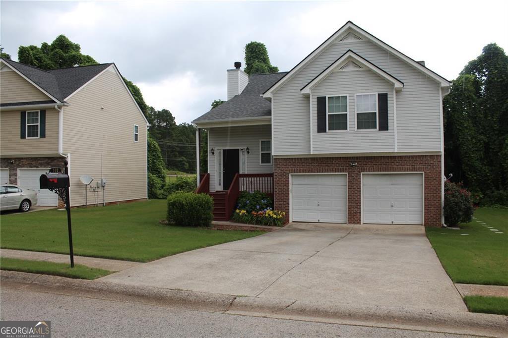 You will love this quiet community minutes away from I-20, City of Villa Rica and local shops and dining! This is a spacious move-in ready multi-level home that includes four bedrooms with three full baths. Open the front door to a light-filled and palatial open-concept layout ideal for everyday living and entertaining. The dining room opens to the relaxing family room. The kitchen includes a pantry and looks into both family and dining rooms. Upstairs is another family room with a cozy fireplace. The tranquil primary bedroom and primary bathroom are over-sized and include a garden tub where you can unwind. In addition, there are two comfortable large secondary bedrooms along with a spacious secondary bathroom. Step down into the basement which includes a bedroom, bonus room, and bath. The downstairs can be an entertainment spot for whatever you choose: game room, gym, office, or rental space since it has its own entrance! There are endless possibilities! The back deck overlooks the private wooded backyard. If you're looking for a peaceful setting and everyday convenience, you must make this your family's home!