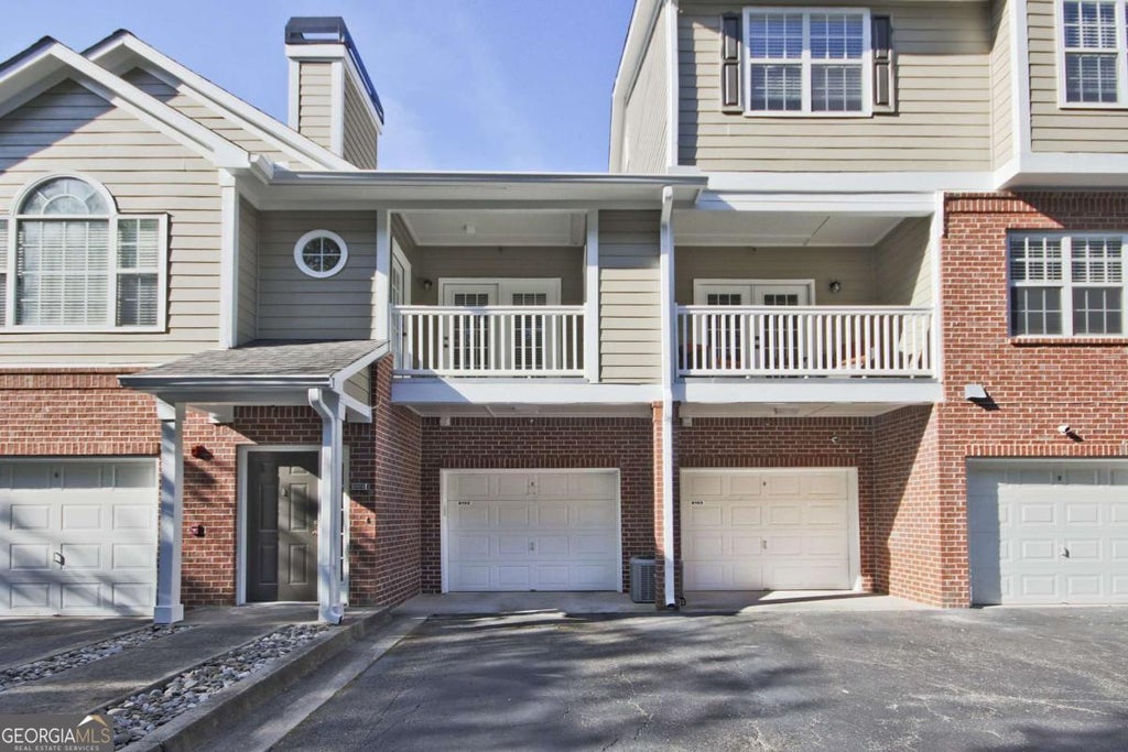 Photo of 8102 WOODLAND Lane #8102, Alpharetta, GA 30009 (MLS # 10779986)