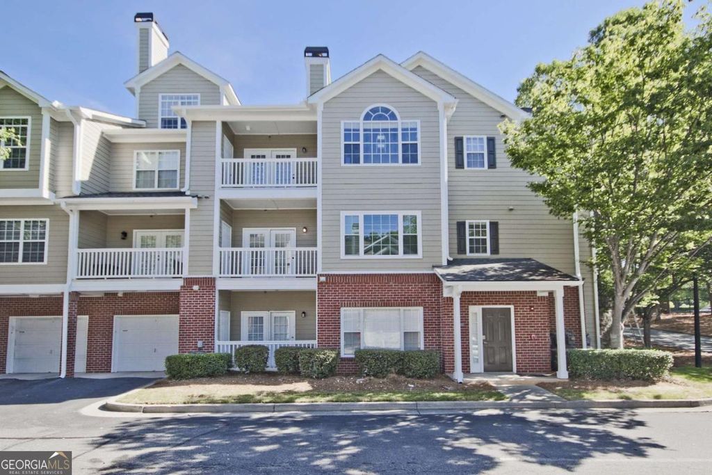 Photo of 8102 WOODLAND Lane #8102, Alpharetta, GA 30009 (MLS # 10779986)