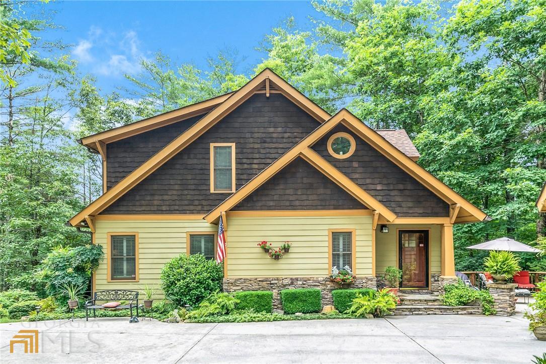 Gorgeous craftsman style home with 4 bedrooms and 3.5 baths, spacious detached garage and large patio area. From the time you enter this home's driveway, the landscaping is truly a treasure. The home has been meticulously maintained by the sellers. Features include an open concept with a large kitchen, dining room and living room. The kitchen has extra cabinetry that has been custom made and extra countertop space with granite countertops. The back deck includes an awning and is able to be viewed from the living room & the dining room. Master is large and has a huge shower and dual vanities. Upstairs is an additional 2 bedrooms and large bathroom. The basement is finished with an additional living room, bedroom, bathroom that has a jetted spa tub. This is all located on over 1.21 acres. The community has a park with a creek to enjoy year round and an option to join the Whitepath Golf Club. Come make this your home sweet home today!
