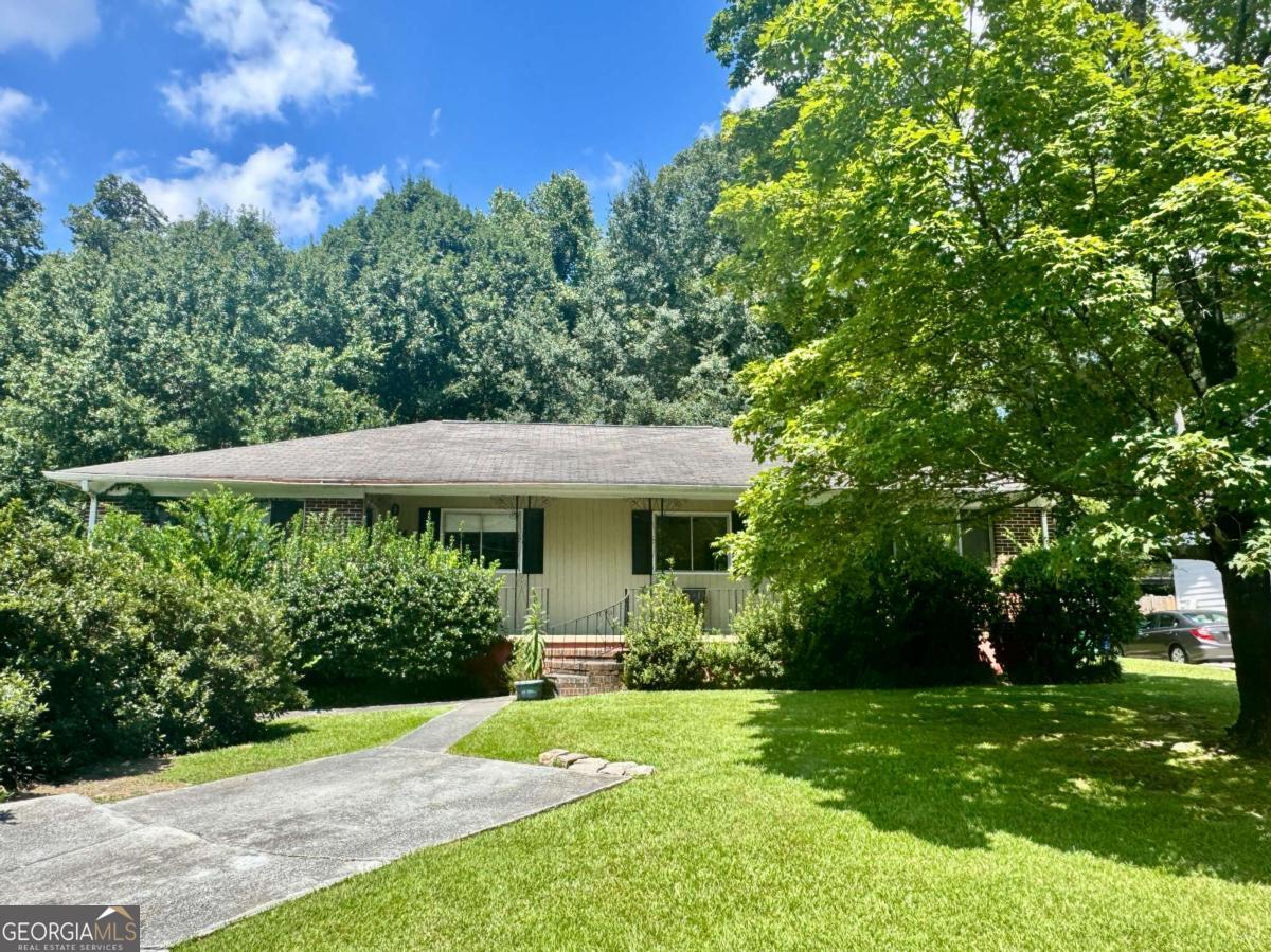 Rare opportunity in the heart of Brookhaven! This tear-down duplex sits on a deep, level lot just over half an acre in the sought-after Ashford Park neighborhood. Surrounded by multi-million-dollar homes, the property offers endless potential to build your dream home or an investment property. Current R-85 zoning. Conveniently located near MARTA, top-rated dining, shopping, and parks. Prime location with easy access to Buckhead, Chamblee, and major highways.