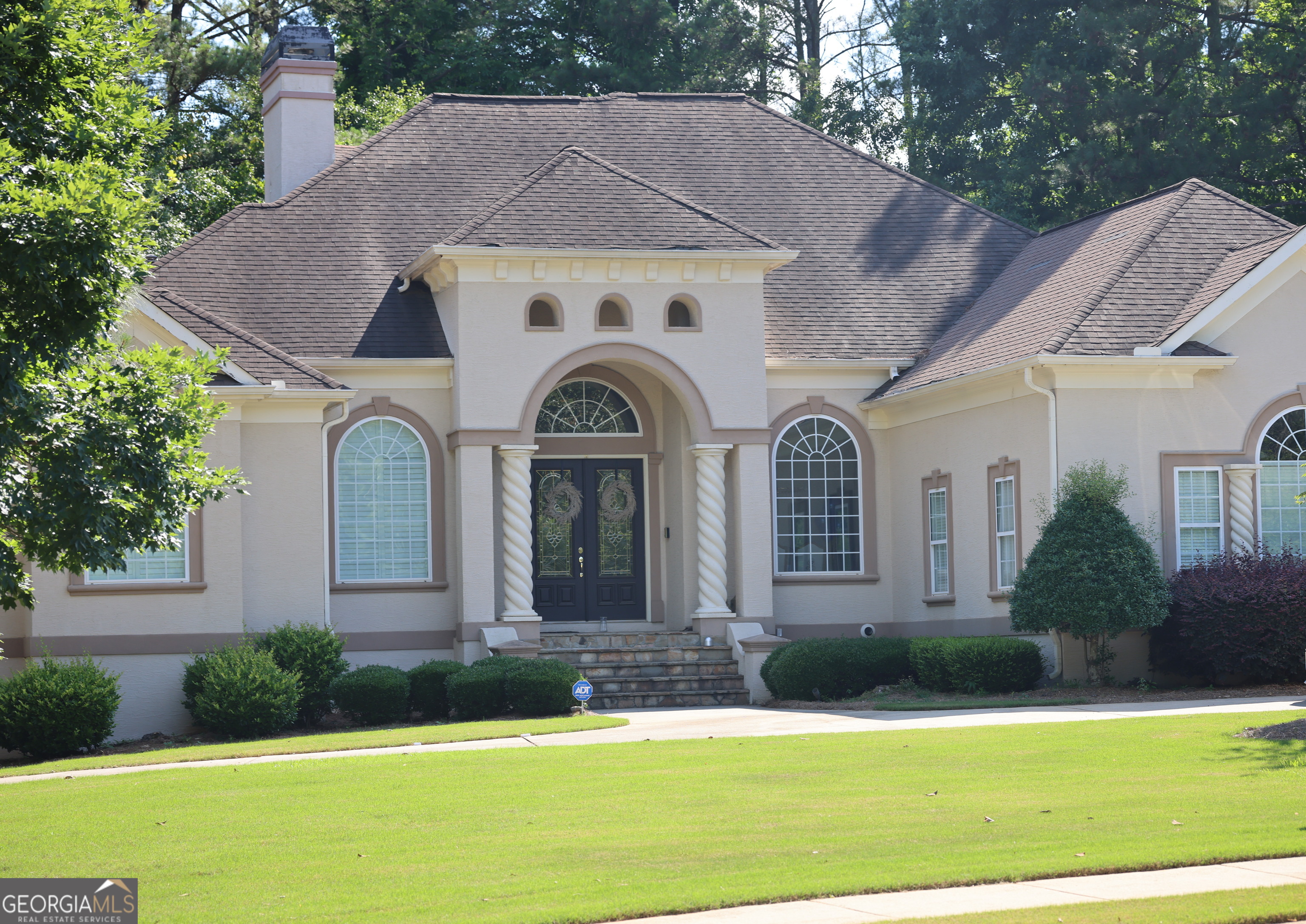 Welcome to a custom-built masterpiece in the exclusive Eagles Landing Country Club Community with 24/7 manned security gate, just 25 minutes from Hartsfield-Jackson International Airport and 30 minutes from downtown Atlanta. This stunning residence offers the perfect blend of luxury and convenience, close to shopping, schools, medical facilities, and more. As you step into the impressive foyer, you'll immediately experience the "wow" factor. The open-concept design features hardwood floors, high ceilings, and an abundance of natural light. The gourmet kitchen boasts stainless steel appliances, granite countertops, and ample cabinet space. This 5-bedroom, 3 full, and 2 half-bath home on a corner lot is designed for comfort and style. The main level includes a 2-car garage, while the basement level offers an additional 1-car garage with an expansive boat storage room and cedar closets. The spacious and versatile floor plan includes a Jack & Jill bathroom opposite the main level owner's suite, and both main and lower-level bedrooms open to charming porch/patios. The finished basement features a second kitchen, family room, and fireplace, creating inspiring spaces for everyone to enjoy. With its stunning curb appeal, circular driveway, and garages on either side of the house, this home is a true gem. Don't miss the opportunity to own this exceptional property in one of Atlanta's most prestigious communities!