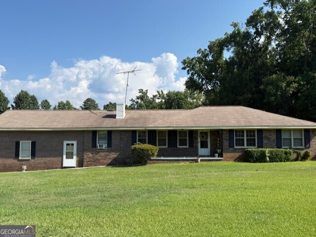 Welcome to this beautifully refreshed, move-in-ready ranch nestled in the heart of Monticello. Featuring a solid 4-side brick exterior, this home offers timeless appeal and low-maintenance living. Step inside to a spacious semi-open floor plan, perfect for entertaining or everyday comfort. The generously sized kitchen offers plenty of room to gather and cook with ease. You'll appreciate the well-maintained interior, abundant wall space for your personal decor, and natural light throughout. Outside, enjoy the privacy of over 4 acres of land, no HOA, no restrictions, just peaceful living with room to grow, garden, or explore. Homes like this don't last long, schedule your private tour today!