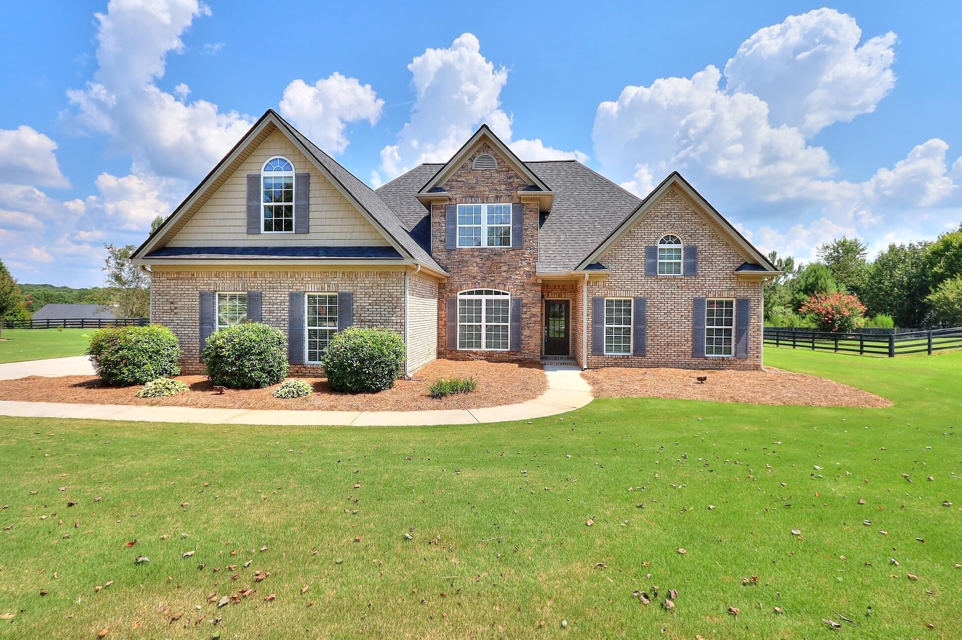 A Fantastic Find is this Stunning 2-Story Home Located in the Sought-After Columns at Providence! Featuring a Beautiful 3-Sided Brick Exterior, this Well Maintained Home Boasts 2546 Sqft. The Open Floor Plan Flows from One Room to the Next w/Open Views Between the Formal Dining Room, Family Room, Kitchen, & Gathering Room. High Ceilings, Crown Molding & Lots of Natural Light. A Large Eat-In Kitchen complete with Granite Countertops, Breakfast Bar, & Coffee bar. One of the Highlights of this Home is the Spacious Owners Suite on the main with Vaulted Ceilings w/En-Suite Tile Shower, Separate Soaking Tub & Double Vanity. 3 Add'l Large Bedrooms Upstairs with Lots of Closet & Storage Space. Upstairs also has a Full Tile bath. Nice size Level Lot with a Private Backyard. Fresh Interior Paint & New Carpet on the Main. This Gorgeous Home is Clean and Move-In Ready. Located just minutes away from the Providence Club Golf Community, Shopping, Schools & Restaurants! This Home is a Must-See!!!