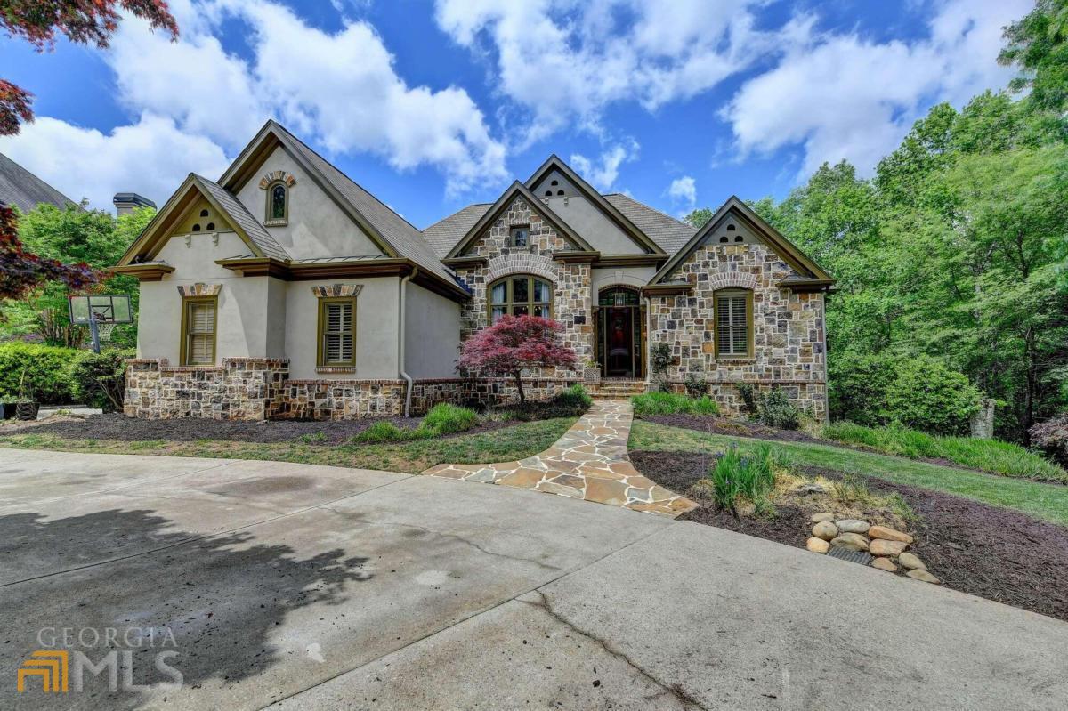 REDUCED $100K & IS PRICED TO SELL!! BEAUTIFUL EUROPEN STONE/STUCCO RANCH IN SOUGHT AFTER LAUREL SPRINGS; SOARING CEILINGS, CUSTOM CHRIS HOUSLEY KITCHEN WITH VIKING STOVE & FRIDGE, OPEN SHELVING; CATHEDRALED GREAT ROOM WITH BEAM; STUNNING DINING ROOM WITH BEAUTIFUL CABINET THAT REMAINS, FRENCH DOORS TO DECK; LARGE LIVING ROOM; MASTER WITH TREY CEILING, BUILT-IN SHELVING IN CLOSET; LAUNDRY HOOK UPS ON MAIN & LOWER LEVEL ; FINISHED LOWER LEVEL INCLUDES LARGE FAMILY ROOM WITH ROOM FOR GYM EQUIPMENT, 3 BEDROOMS & 2 BATHS; DECK OVERLOOKS A PRIVATE FENCED-IN BACKYARD; CIRCULAR DRIVEWAY COMPLETES THIS PROPERTY; ROOF -3 YRS OLD; MAIN FLOOR COMPLETE NEW HVAC UNIT - 3 YRS OLD; WATER HEATER - 1 YR OLD