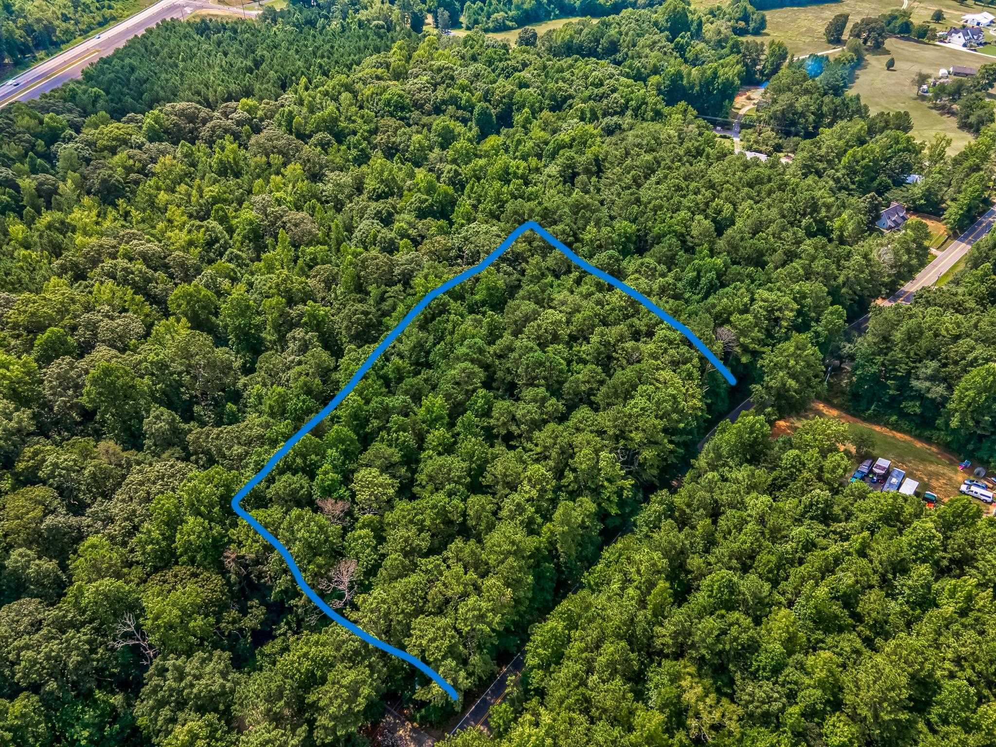 Beautiful 3.62 acres on quiet country street and close to Hwy.92 and Sweetwater Church Road. This wooded acreage has a small stream and a variety of options for house sites, either closer to the road or farther back for optimum privacy. This could be your dream estate property! Located in a nice mix of residential and gentleman farm properties. This is a fantastic value! Don't wait on this one!