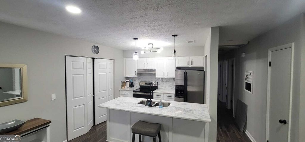 Photo of 8975 Ashwood Drive, Riverdale, GA 30274 (MLS # 10689696)