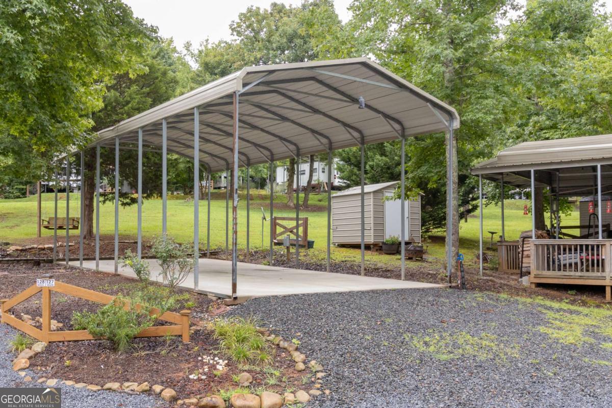 Discover your perfect mountain retreat! Lot 127 in the Talking Rock Creek RV Resort is a perfect vacation spot for family and friends, this property is your gateway to making lasting memories. Picture yourselves roasting marshmallows by the inviting fire pit, launching boating excursions on Carter's Lake, wandering through scenic nature trails, and enjoying lively tennis or basketball matches. Cool off in the community pool or unwind in the serene surroundings, making every gathering special. Welcome to your ultimate mountain escape!
