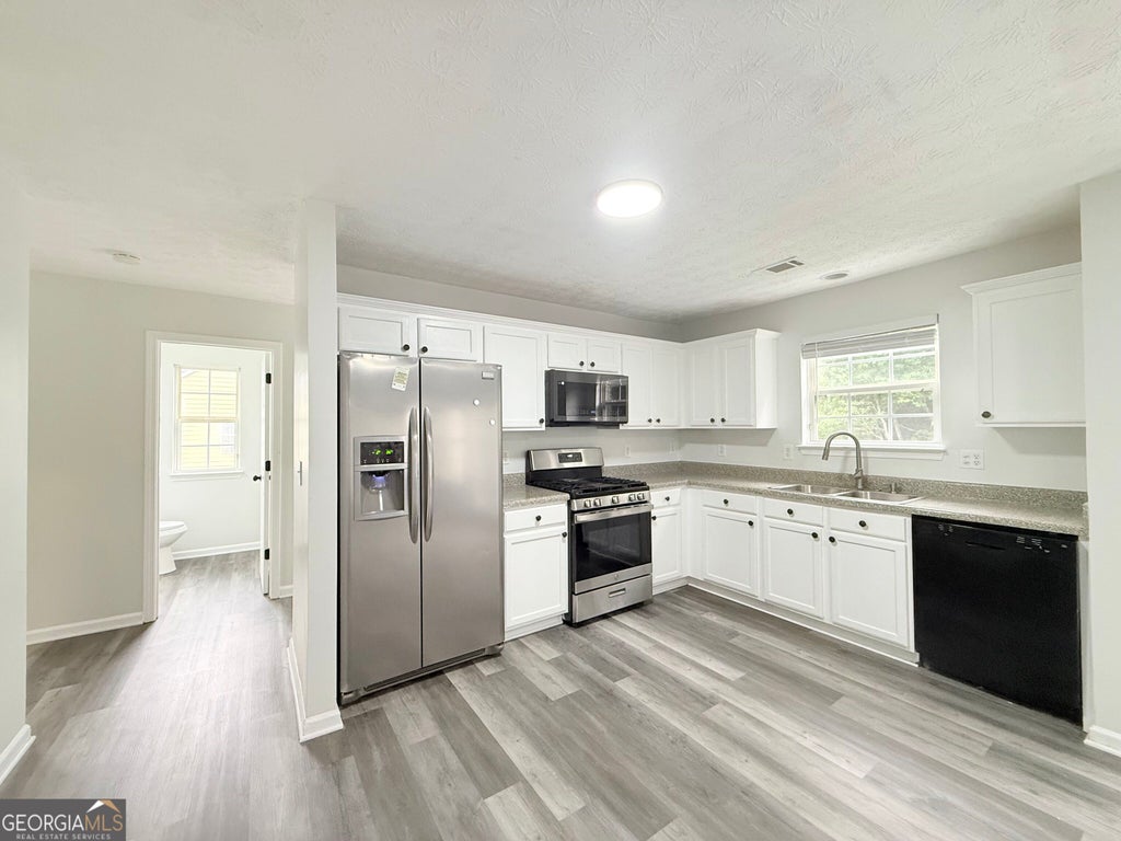 Photo of 928 Shannon Road SW, Loganville, GA 30052 (MLS # 10880670)