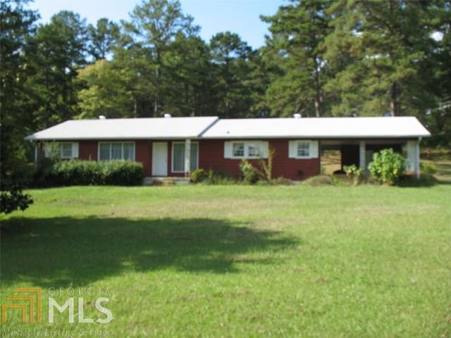 Well maintained 3/2 ranch on 11 acres. large rooms. 2 large living spaces. Home is on well water and not conneted to public water but access is close to home.