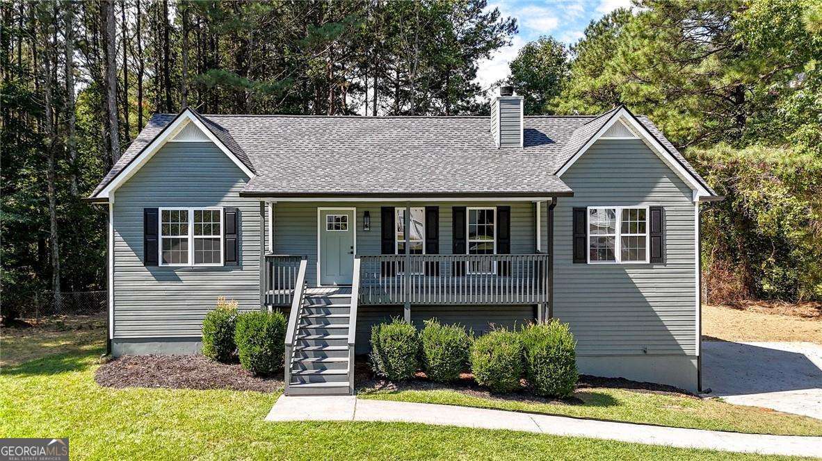 Welcome to this beautifully renovated 4-bedroom, 3-bath home offering modern comfort and move-in ready convenience. The open-concept main level features a spacious living room that seamlessly connects to the dining area, creating the perfect setting for entertaining. The brand-new kitchen showcases white shaker cabinets, sleek quartz countertops, and stainless steel appliances. The main floor also includes a generous owner's suite with a luxurious tub and shower, plus two additional bedrooms and a full bath. Downstairs, the fully finished basement provides a fourth bedroom, third full bath, and a versatile living area-ideal for an in-law suite, teen space, or rental opportunity. Peace of mind comes with all major updates completed, including a new roof, HVAC system, window, sliding glass door, and water heater. Conveniently located just off Highway 92, this home offers quick access to I-20, shopping, dining, and more.