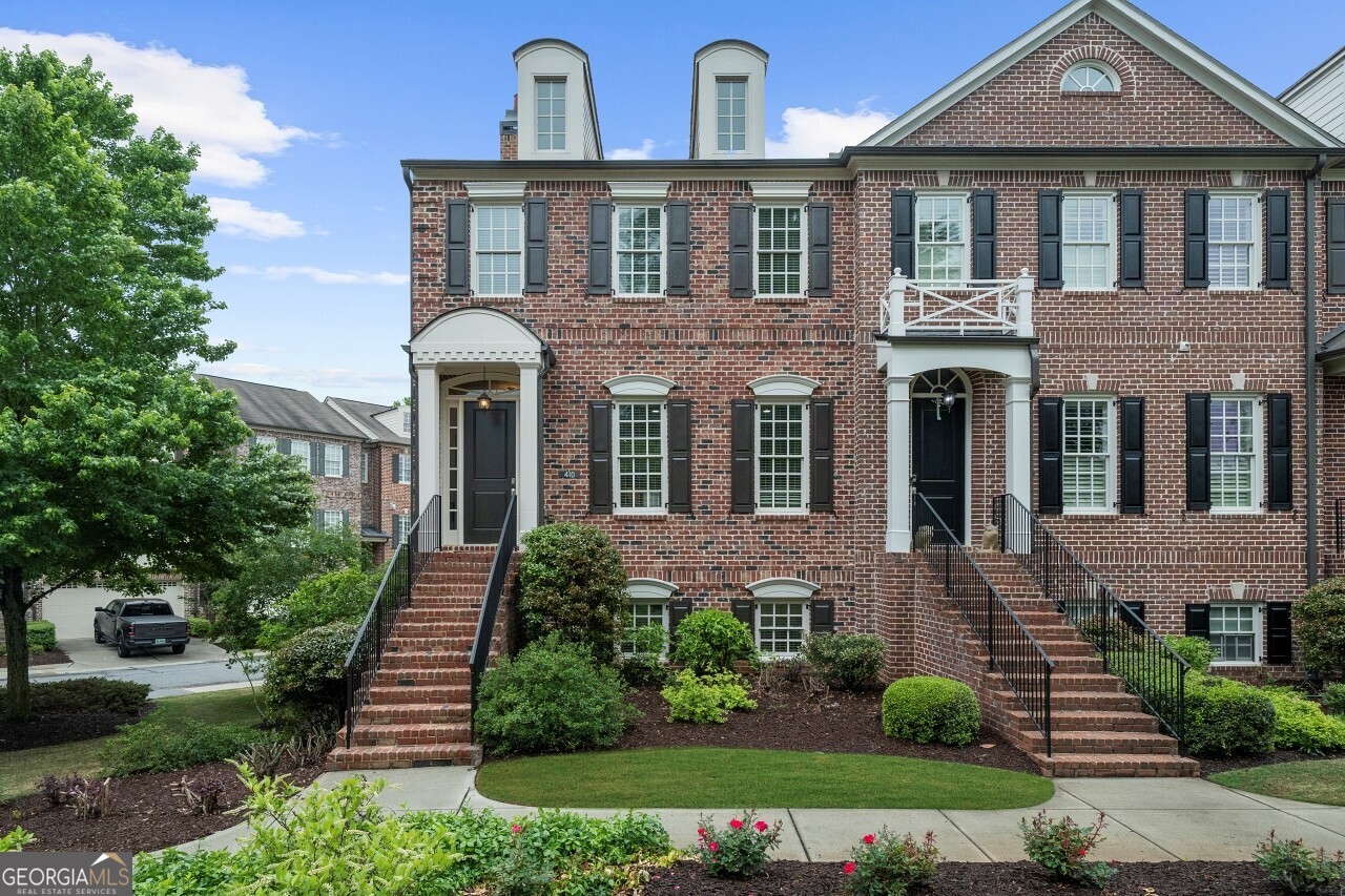 Discover the perfect blend of elegance and vibrant city living in this stunning 3-bedroom, 3.5-bath corner townhome at The Georgian, steps away from the buzzing heart of downtown Alpharetta. Come inside to an open-concept masterpiece featuring gleaming hardwood floors on all 3 levels, a cozy fireside family room wrapped in chic shiplap, and a gourmet kitchen with updated cabinetry designed to dazzle your guests. With serene views of the lush front lawn, this space effortlessly invites you to unwind or entertain in style. Retreat upstairs to the luxurious primary suite, boasting a custom walk-in closet as functional as it is fabulous. The versatile lower level transforms to fit your lifestyle whether you crave a media haven, a sleek home office, a lively game room, or an extra bedroom (with full bath!). With plenty of storage and a spacious garage, every inch of this home is designed for convenience and sophistication. Plus, water and sewer are included, making life here even easier. Step outside and immerse yourself in the vibrant Alpharetta scene just a short stroll to the lively farmers market, the electric atmosphere of concerts on the lawn at Brooke Street Park, mouthwatering dining at fantastic restaurants, and the ever-popular Food Truck Alley. This rare rental gem offers an unbeatable combination of upscale finishes, flexible living, and an unbeatable location, delivering the ultimate lifestyle where comfort meets excitement.