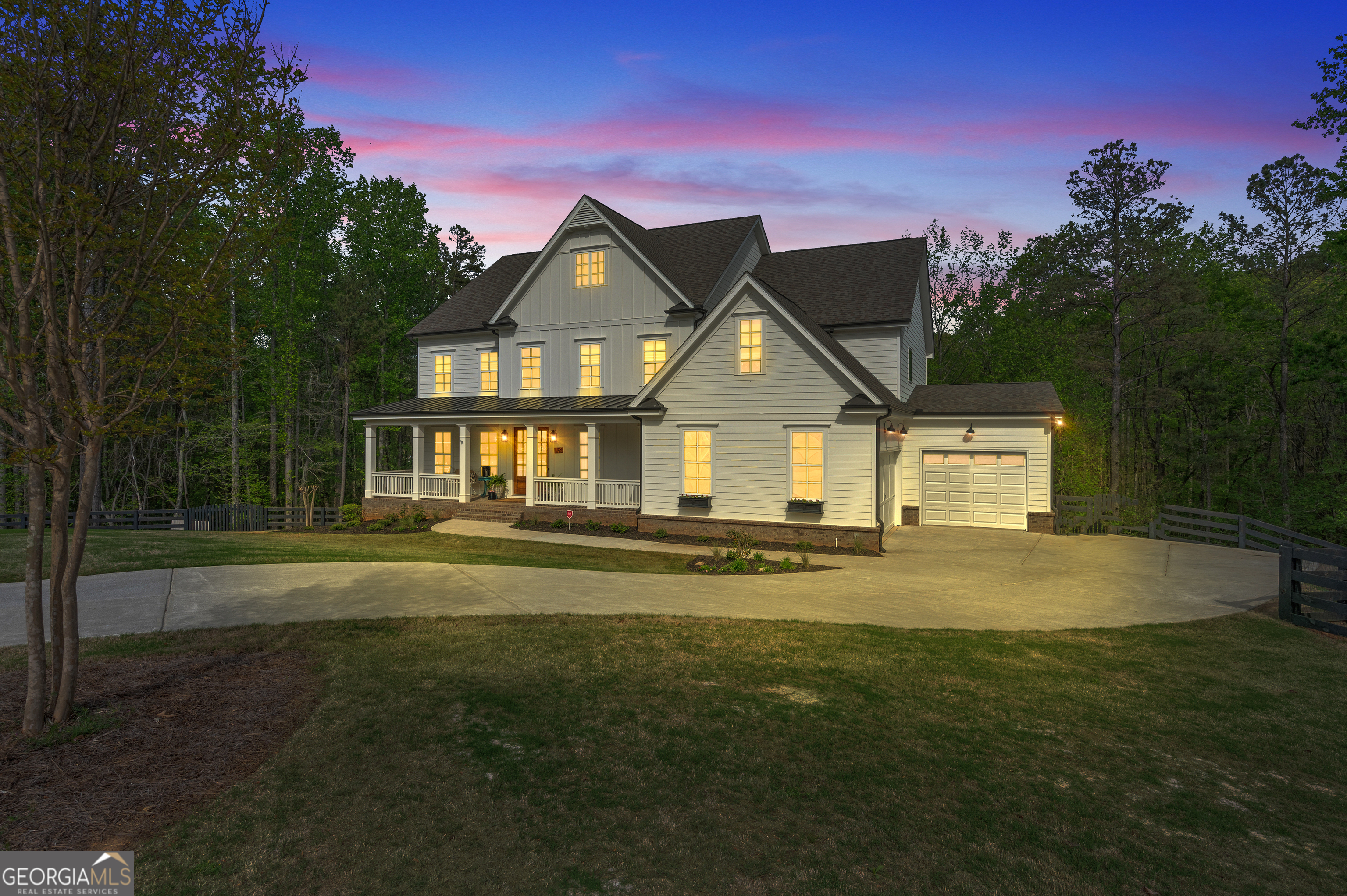 Welcome home to this stunning farmhouse on a double cul-de-sac lot! No HOA on a dream fenced in backyard! Spacious and light filled floor plan with gleaming hardwood flooring throughout the main level and tons of updates throughout! Formal living room with custom designer oversized doors and large formal dining room welcome you from the grand entrance foyer. Fireside family room with stunning custom fireplace! The gourmet kitchen, complete with a 36-inch 6-burner Wolf range, Bosch dishwasher, beautiful quartz countertops and extra prep sink, flows into the family room, perfect for entertaining! Custom pantry blends modern design and practicality! Private guest bedroom with a full bath on main. Ascending upstairs, you'll find 3 large secondary bedrooms and a spacious media room Plus the sprawling owner's retreat with luxurious master spa featuring large his-and-her closets, free standing soaking tub and an oversized shower with dual heads and huge walk-in closet! Plenty of space below in the unfinished basement which is ready for you to complete and personalize and boasts 10" ceilings! Three car garage with space for a 24 ft. boat- just 45 minutes from Lake Lanier! Top-rated school district and only 20 minutes from Cumming City Center and the Avalon! Agent Owned.