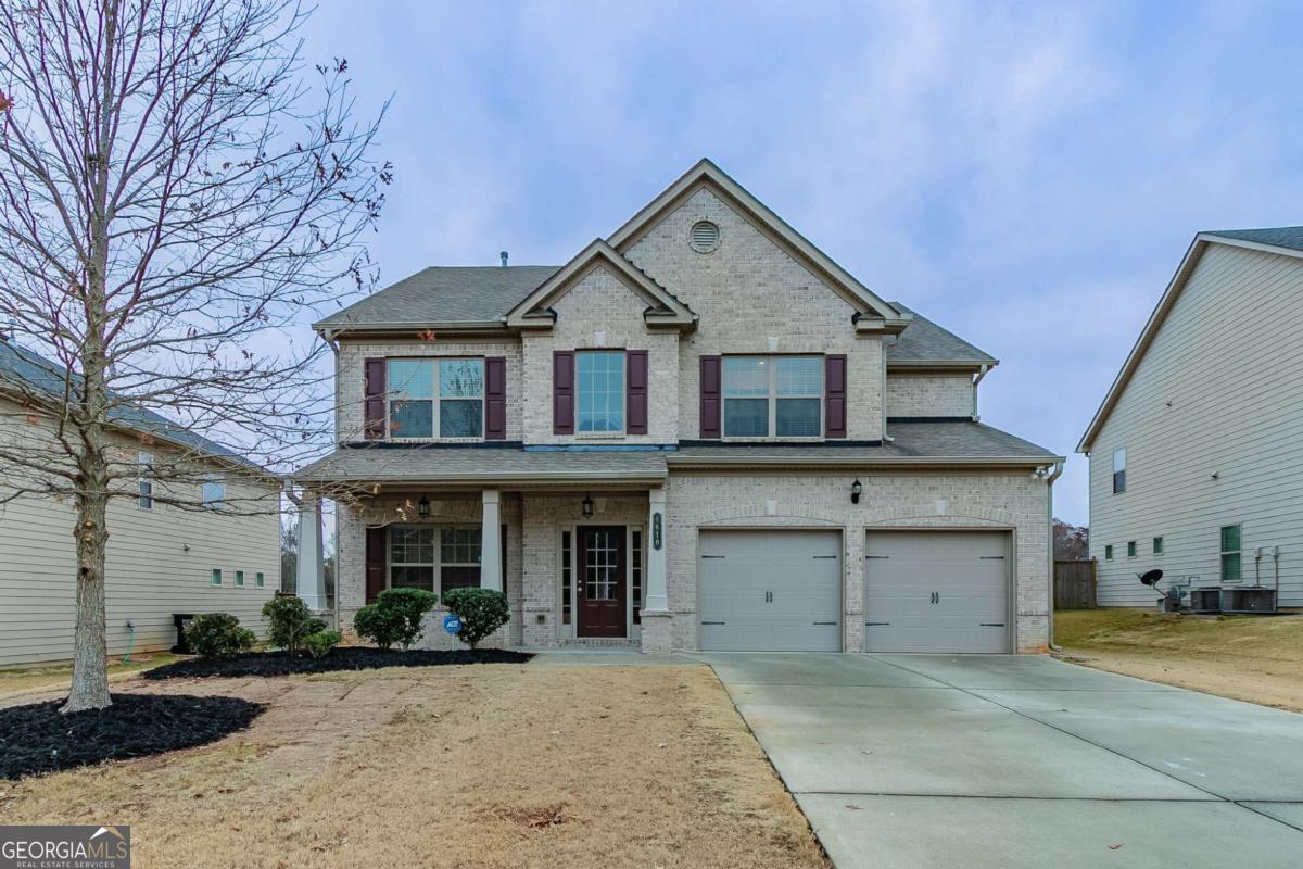 Don't miss your chance to own this meticulously maintained 5-bedroom, 3-bathroom gem located in the highly sought-after Alpharetta area. With quick access to GA-400, this home is ideal for commuters while offering a peaceful retreat just minutes from everything you need. From the moment you enter, you'll be impressed by the flawless craftsmanship and attention to detail. The home has been completely repainted inside, offering a fresh, modern look. Gorgeous hardwood floors flow throughout the main level, paired with soaring ceilings and elegant crown molding that give the home a refined, open feel. The open-concept design seamlessly connects the chef-inspired kitchen to the spacious family room, making it perfect for both everyday living and entertaining. Whether youCOre hosting family gatherings or enjoying quiet nights at home, the kitchen's large island and abundant cabinet space make cooking a breeze. The family room is both inviting and functional, with a gas fireplace and large windows that bathe the room in natural light. You'll love the formal dining room with its dramatic coffered ceiling, perfect for elegant dinners or holiday celebrations, and the formal living room adds even more space for relaxation or entertaining. Plus, a bedroom on the main level offers convenience and comfort, complete with a large closet and direct access to a full bathroom. Upstairs, the expansive ownerCOs suite is truly an oasis, featuring cathedral ceilings and a separate sitting area with enough room for a sectional. The luxurious ensuite is a dream, with a soaking tub, separate stand-up shower, dual vanities with ample counter space, and his and her closets Co offering both privacy and functionality. All three additional bedrooms upstairs are generously sized with plenty of space and feature spacious closets and high ceilings. Step outside to the fully fenced backyard and covered patio, ideal for relaxing or entertaining in complete privacy. The space is perfect for hosting outdoor gatherings year-round.