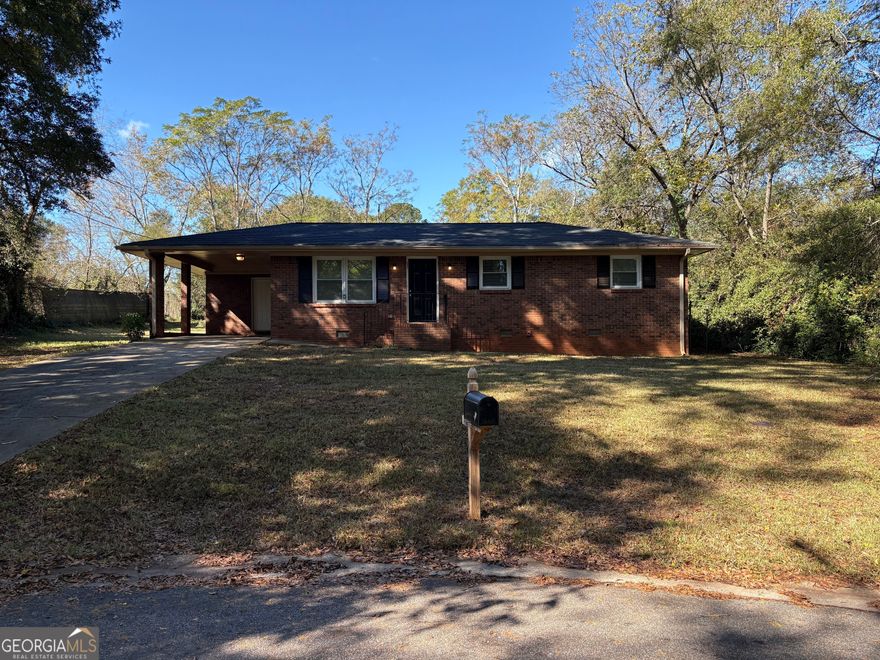 Discover this updated single-story brick home offering approximately 1,032 sq ft of living space on a generous 9,583 sq ft(0.22-acre) lot in Monroe's welcoming Maple Heights neighborhood. The residence features 3 bedrooms and 1.5 bathrooms, with gleaming hardwood flooring throughout the living areas and a bright white kitchen completed by modern appliances and ample cabinet storage. The open living/dining zone flows to a covered carport and a fenced backyard - the perfect space for weekend barbecues or quiet evenings at home. Located just minutes from local boutiques and eateries downtown, easy access to major roads and within reach of parks and recreation, this home places you a short drive from the scenic lake-area and community gatherings.    With nearby shopping and the town's historic charm, this property offers both convenience and character. Don't miss your opportunity to own in this friendly, centrally located community.