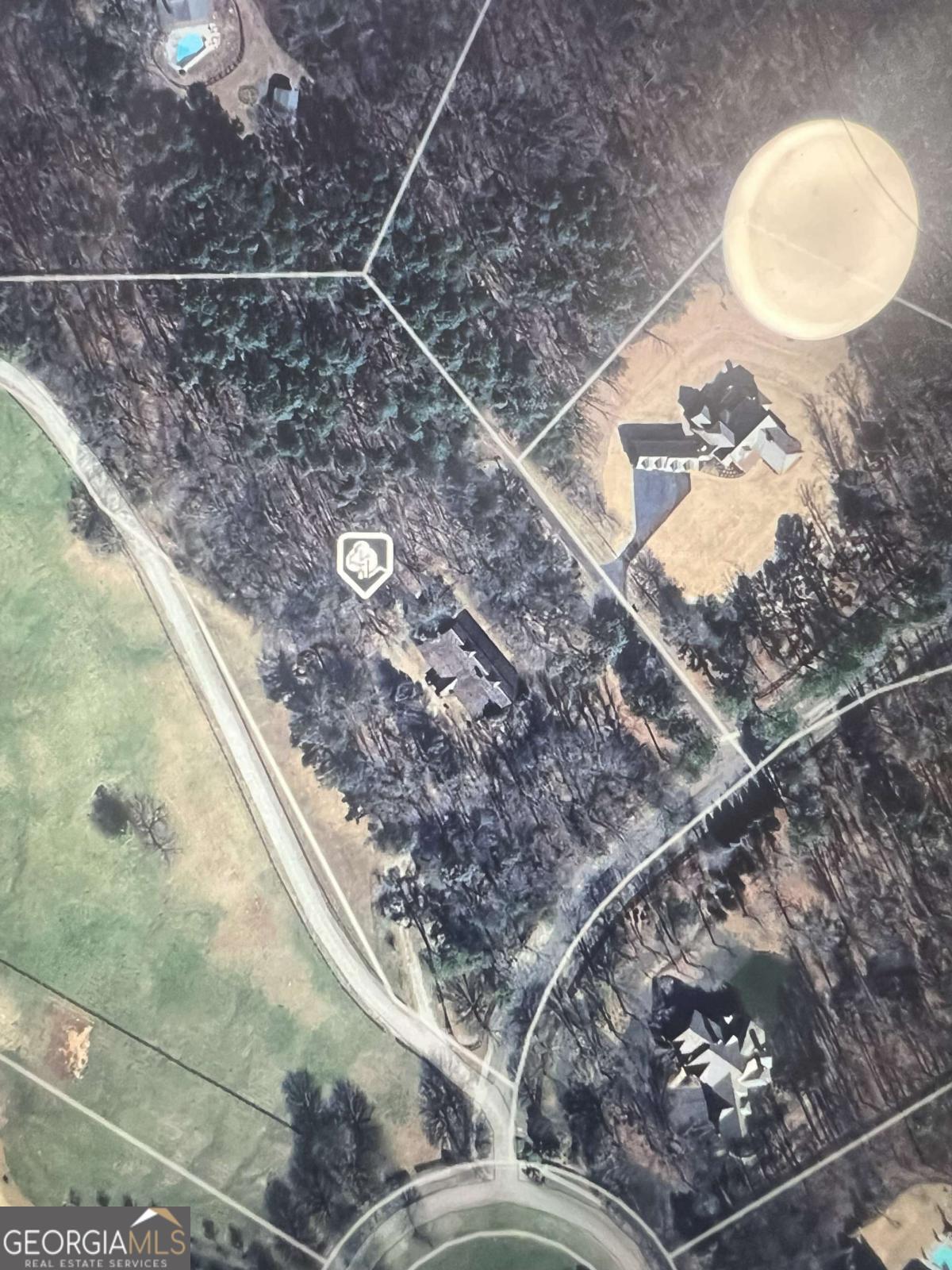 5.92 acre Estate home site inside the gated Woodhaven Bend subdivision on the Etowah River. This lot has a fabulous existing barn that features a small living area and a half bath on the property that is ready for a conversion to a barndominium or build your estate home on the lot and have the barn for recreational purposes, car collections, horses, or guest house. The possibilities are endless. Woodhaven Bend is a gated sanctuary of 32 custom Estate home sites. This peaceful community offers, walking and riding trails, a boat ramp for access to the Etowah River, and beautiful rustic pavilions along the nature trails for community events and enjoyment. Centrally located near Ball Ground, Canton, Woodstock, Milton, Cumming and Dawsonville. Come and see this beautiful lot and Barn and think of all the options for your dream home.