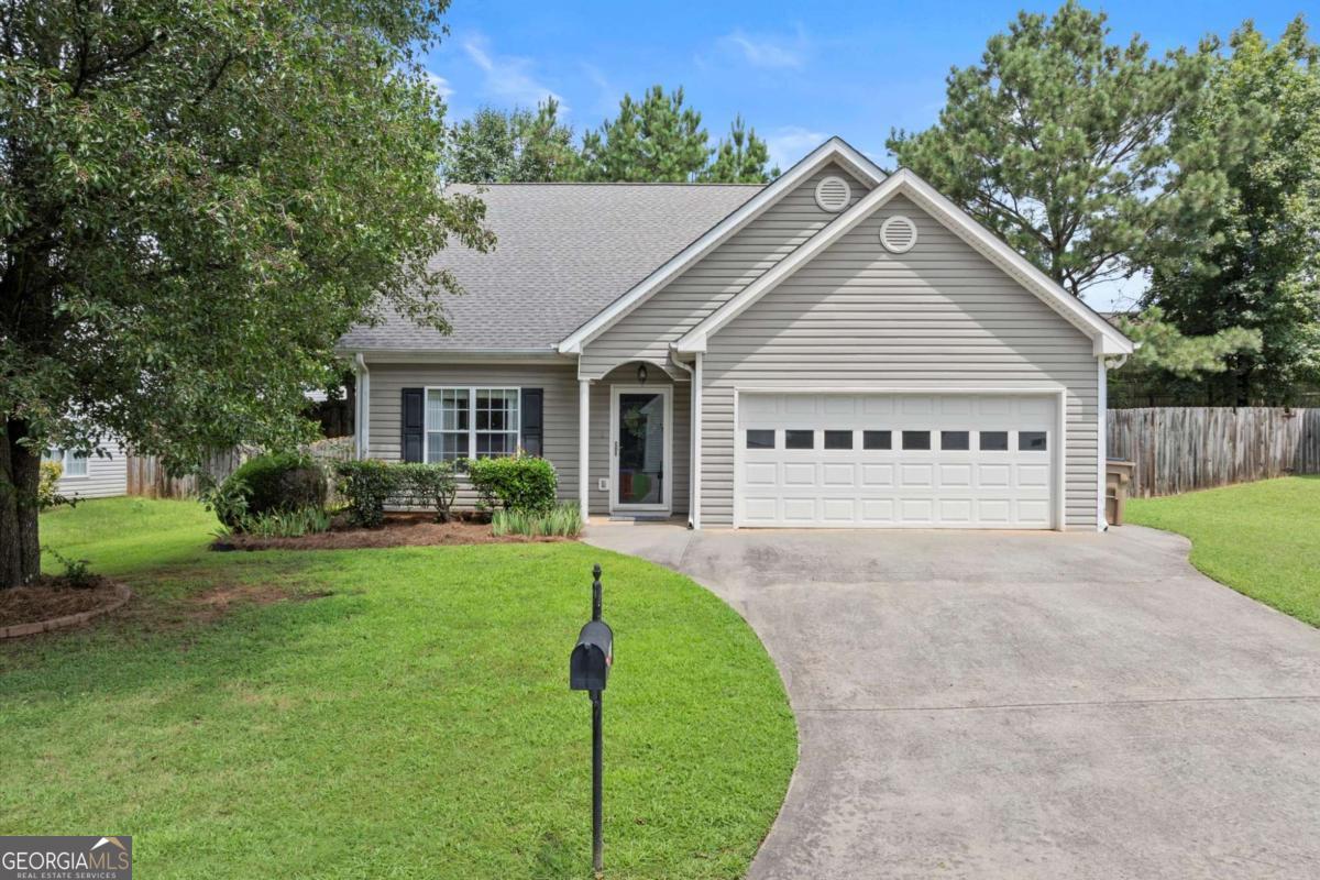 Welcome! This charming home offers the perfect blend of style, comfort, and low-maintenance living in a fantastic Holly Springs location. The spacious, open-concept layout features the primary suite on the main level, providing ease and convenience for everyday living. You'll love the vaulted fireside family room, filled with natural light and open to the dining area and kitchen-complete with gas range, breakfast bar, and direct access to your private back patio, perfect for morning coffee or casual entertaining. Upstairs, you'll find two generous secondary bedrooms, a full bath, and a versatile loft-ideal for a home office, playroom, or cozy retreat. The home also includes a 2-car garage- No HOA! Whether downsizing, right-sizing, or just starting out-this home is a must-see!