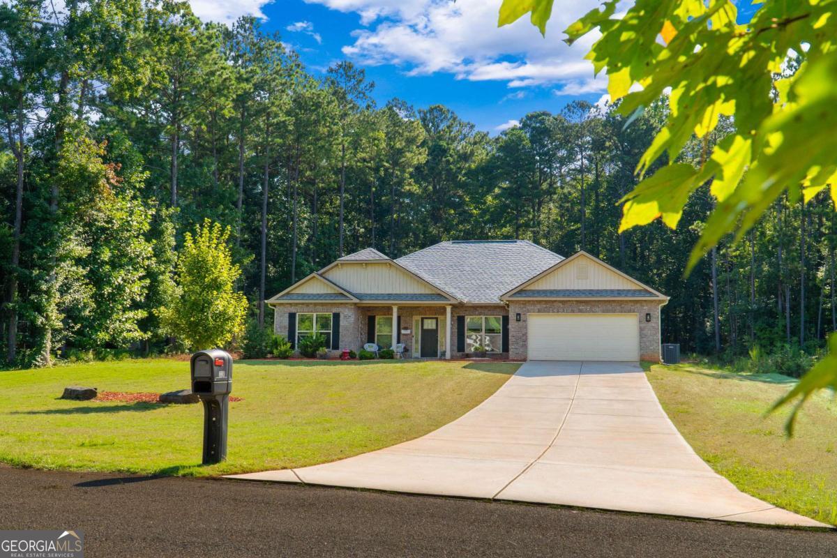 Welcome to this beautifully maintained, one-level ranch home offering the perfect blend of comfort and style. Situated on a generous 0.76-acre lot (over 3/4 of an acre), this property boasts a spacious front yard and backyard, providing ample room for outdoor activities, gardening, or simply enjoying the open space. Featuring 4 spacious bedrooms each having their own walk-in closet and 2.5 bathrooms, this home provides ample space for families of all sizes. The inviting open-concept design seamlessly integrates the living, kitchen, and dining areas, creating a perfect flow for day-to-day living and entertaining. The formal dining room adds an elegant touch, perfect for hosting dinners or special occasions. Step outside to the expansive covered back patio, ideal for hosting guests or relaxing on a quiet evening. The extended patio area offers even more room for outdoor enjoyment, making it a fantastic space for gatherings and outdoor living. With an extended driveway, parking is never an issue, and the convenient location offers easy access to all that the area has to offer. Located in 100% USDA home loan area, this charming ranch home is the perfect combination of modern amenities, open spaces, and relaxed living. Schedule your tour today and imagine yourself enjoying this beautiful space!