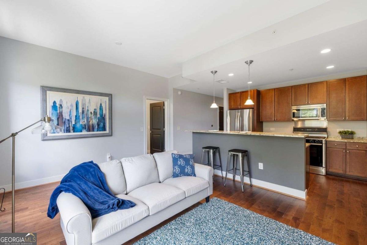 Live in the Heart of It All - The Artisan, Downtown Decatur's Premier Address Welcome to 201 W. Ponce De Leon Ave NW #35, a beautifully appointed 2-bedroom, 2- bathroom condo nestled in the sought-after Artisan building-Downtown Decatur's gold standard for upscale, intown living. Step inside and discover an open, sunlit layout featuring granite countertops in both the kitchen and bathrooms, rich hardwood floors, and sleek stainless steel Bosch appliances ready to elevate your culinary game. Enjoy a morning coffee or evening wind-down on your private walk-out balcony, with city energy below and skyline views above. This home offers not just style but security and convenience-with covered, secure parking and controlled access throughout the building. Be confident knowing that the HVAC and water heater has been replaced by the owner in June 2025, with manufacturer's warranty in place and transferable to the new owner. Head upstairs to the 5th floor amenity level, where you can soak up sunset views by the pool, squeeze in a workout in the fitness center, or host friends in the media and community lounge. It's resort-style living, right at home. Location? Unbeatable. You're just steps from Decatur Square, MARTA, and Emory Cliff shuttle, with dozens of award-winning restaurants, charming boutiques, grocery stores, the library, and local events all within a short stroll. Not to mention, it's zoned for top-rated Decatur schools. Whether you're commuting, dining out, catching a concert on the square, or enjoying a quiet evening at home, this condo delivers the best of city living with the charm and warmth of a true community. Come see what life at The Artisan is all about. Your new home in the heart of Decatur awaits!